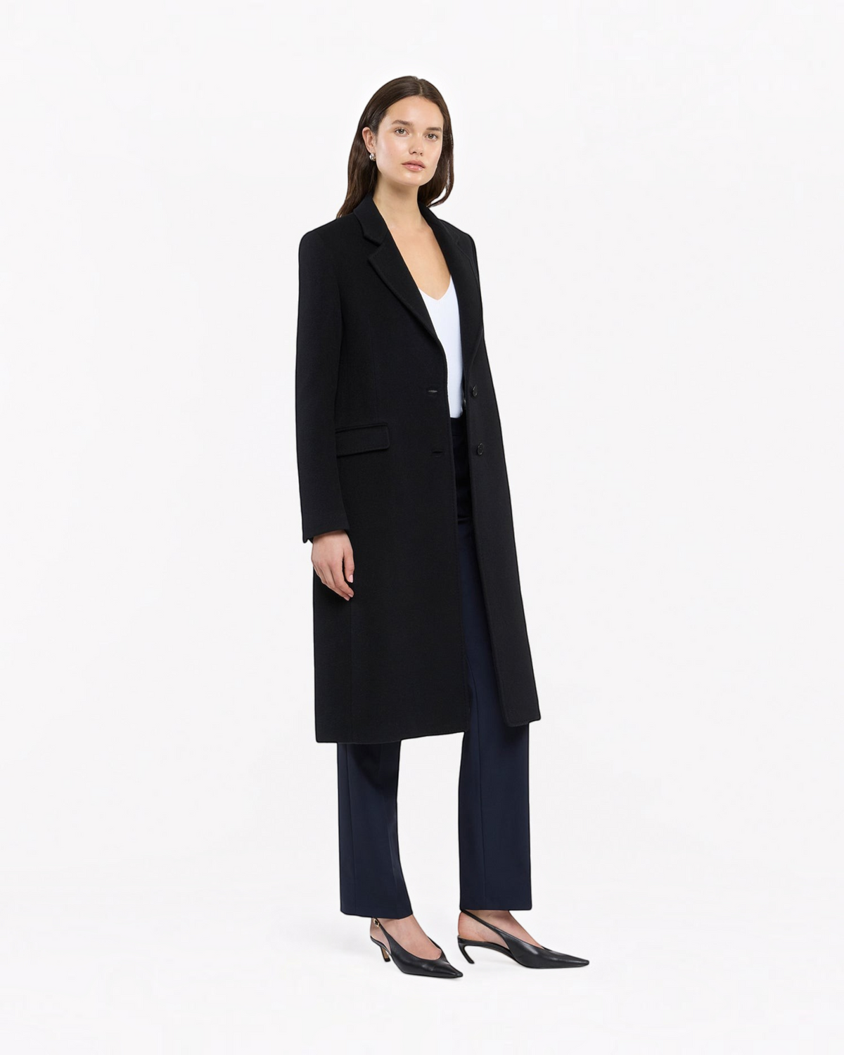 Weldun black cashmere tailored overcoat worn by a model with a white top and dark trousers