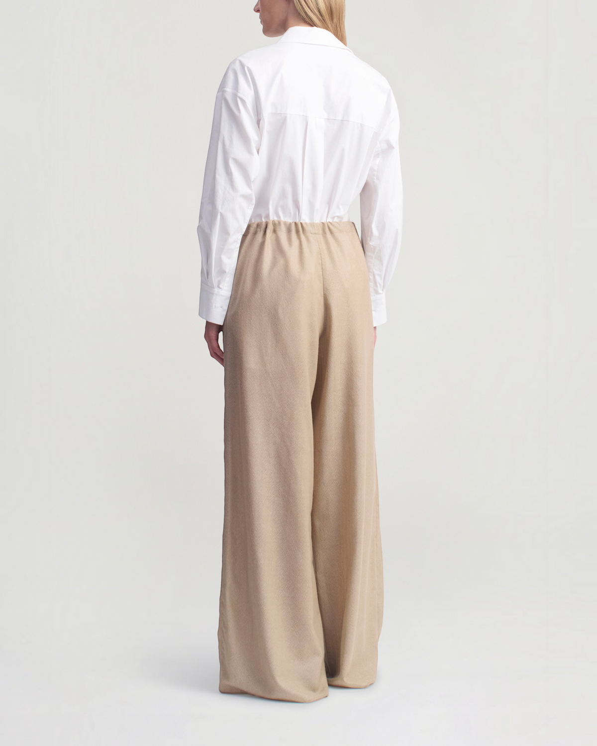 Back view of Weldun Cairo Pant in taupe featherweight wool, featuring a wide-leg fit and adjustable waistband.