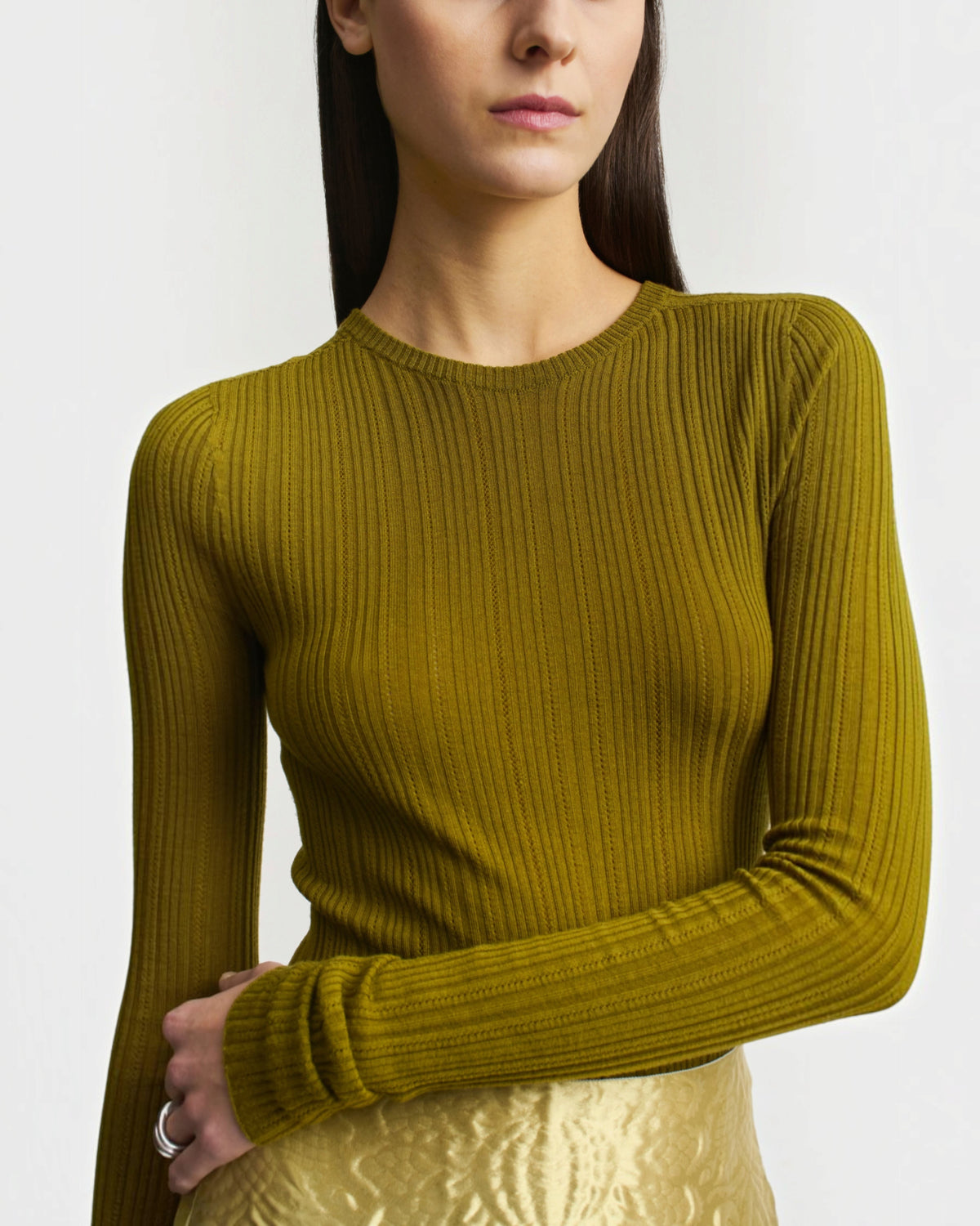 Weldun KALLMEYER olive green superfine pointelle long sleeve top with a fitted silhouette and round neckline.