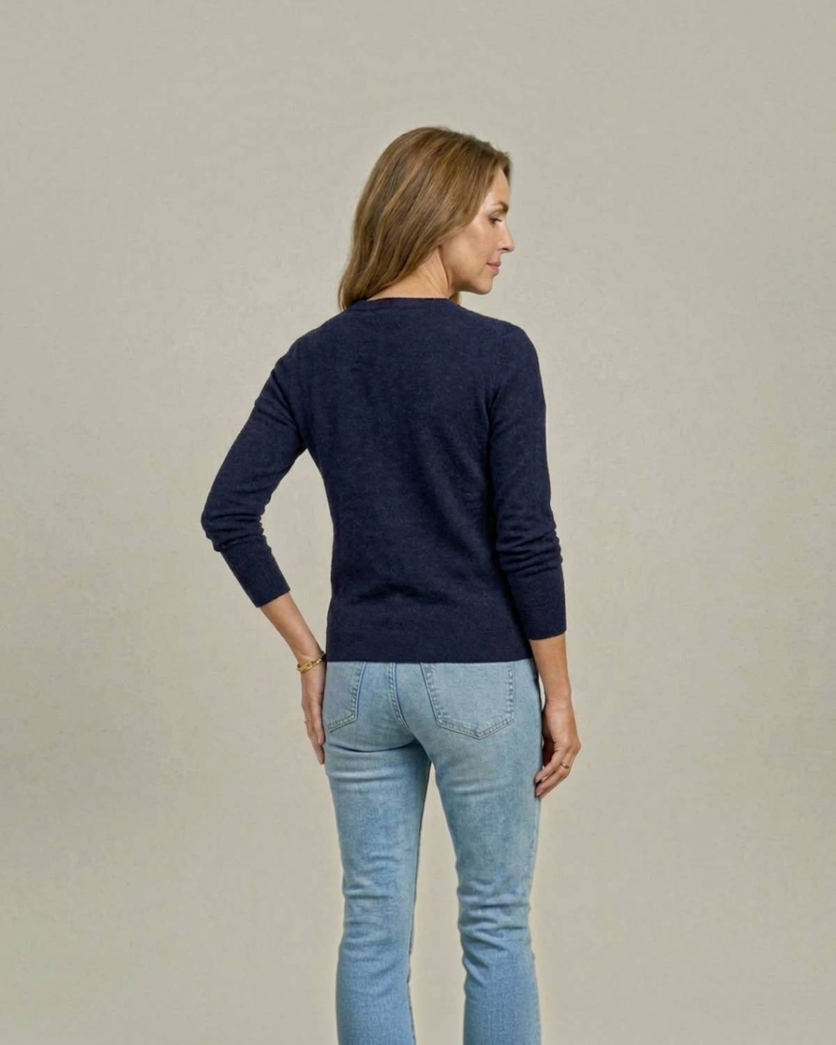 Weldun women's navy adaptive knit cardigan sweater worn by a model, back view showing soft rayon-nylon blend fabric.