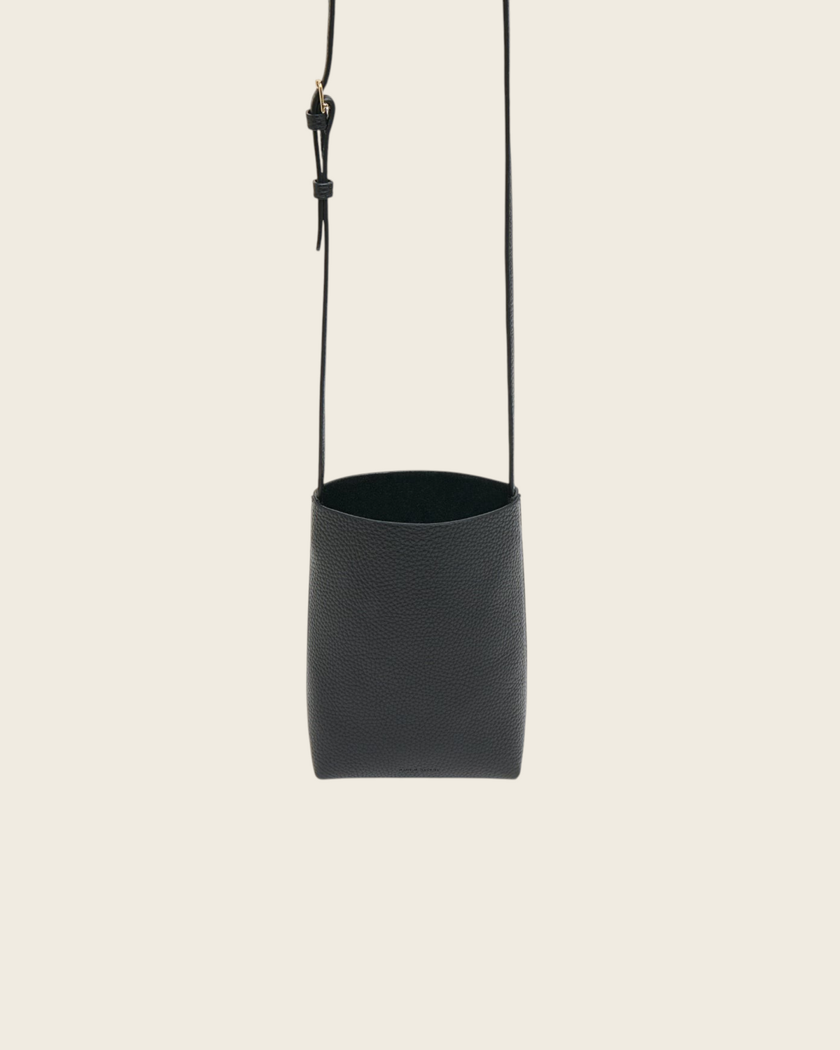 Weldun Mansur Gavriel black pebbled leather Everyday Cabas crossbody bag with an adjustable shoulder strap.