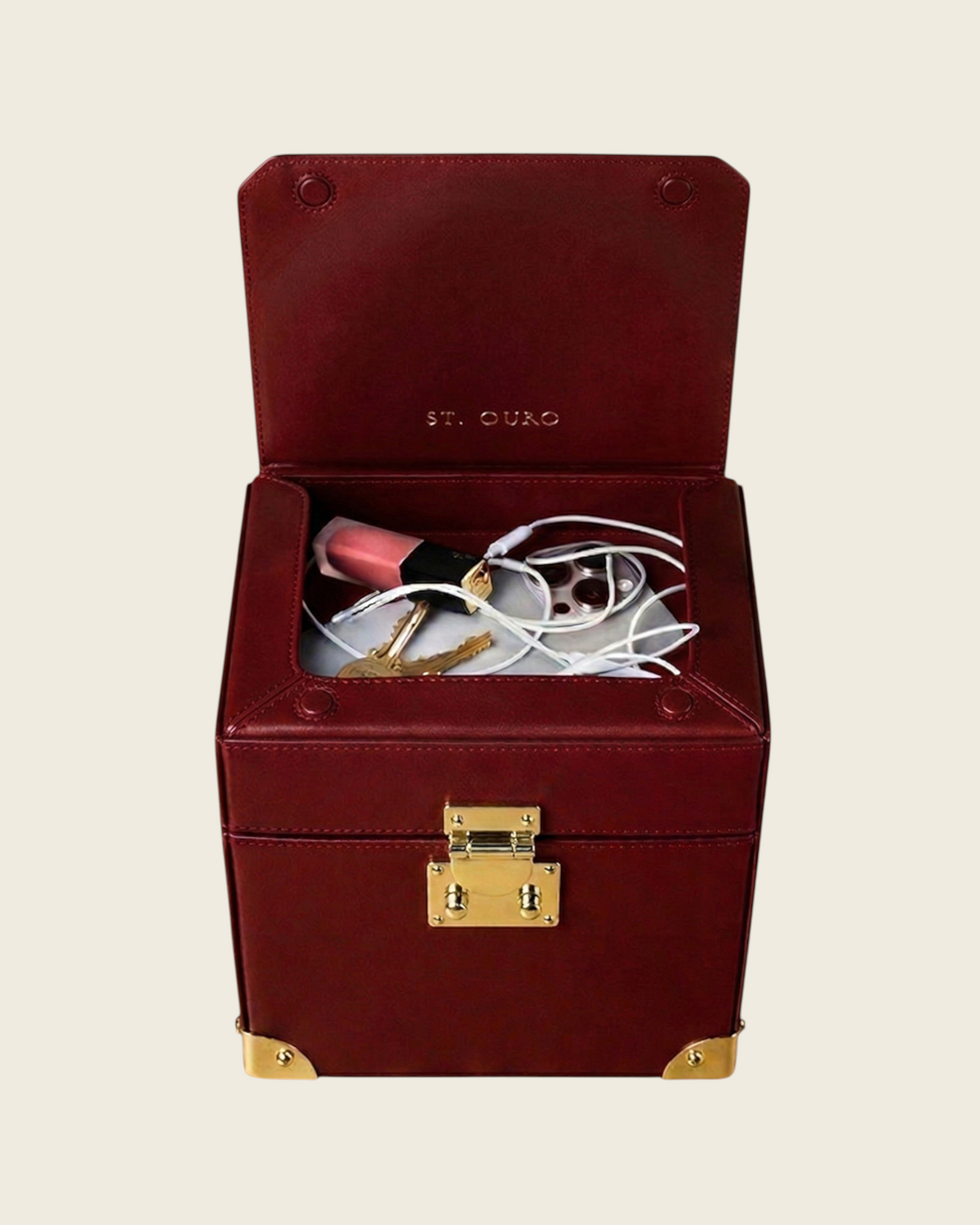 Weldun Themis breastmilk cooler in deep red nappa leather with gold hardware and open top compartment for essentials.