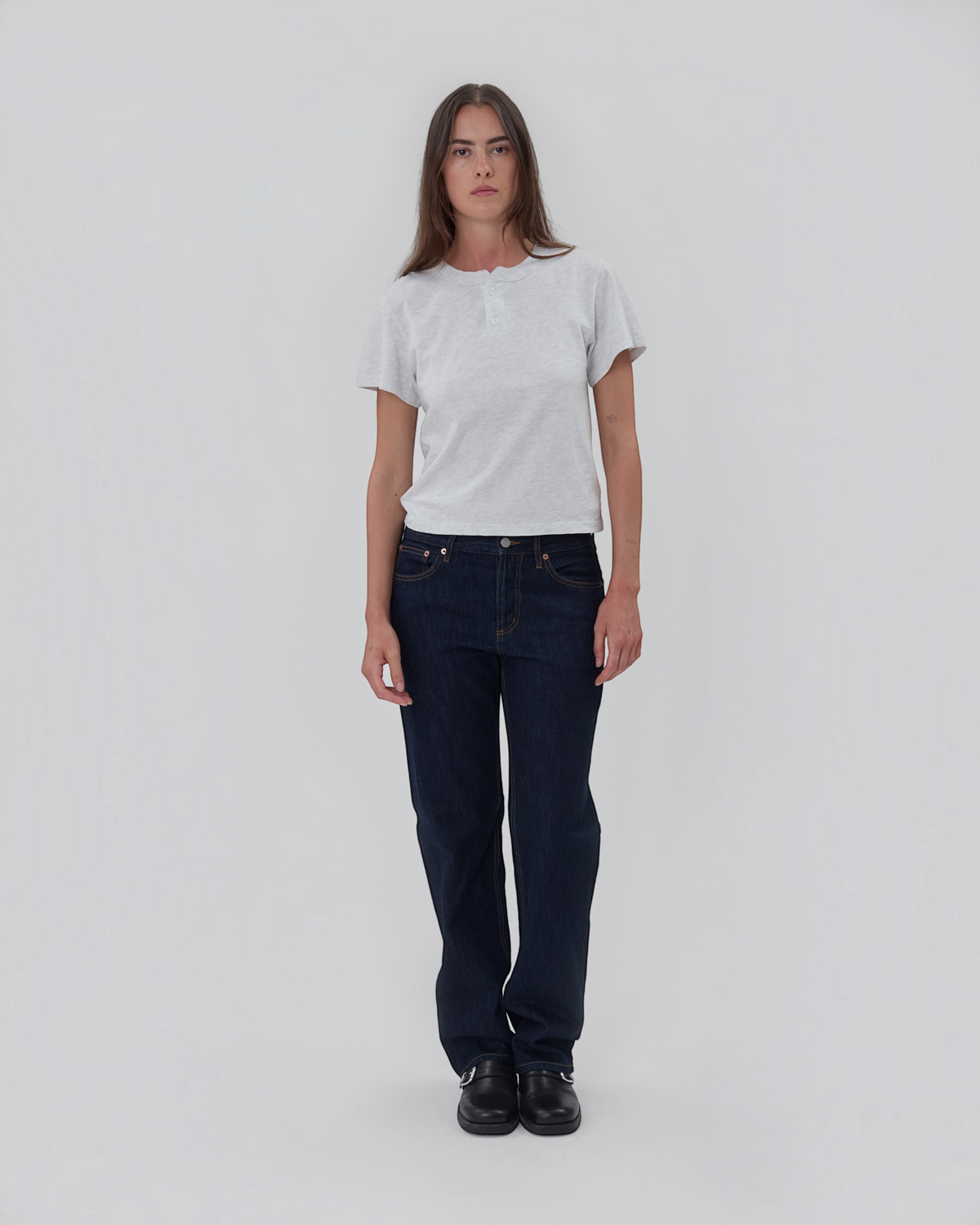 Weldun model wearing a grey 100% cotton short sleeve Henley shirt with a two-button placket and relaxed fit.
