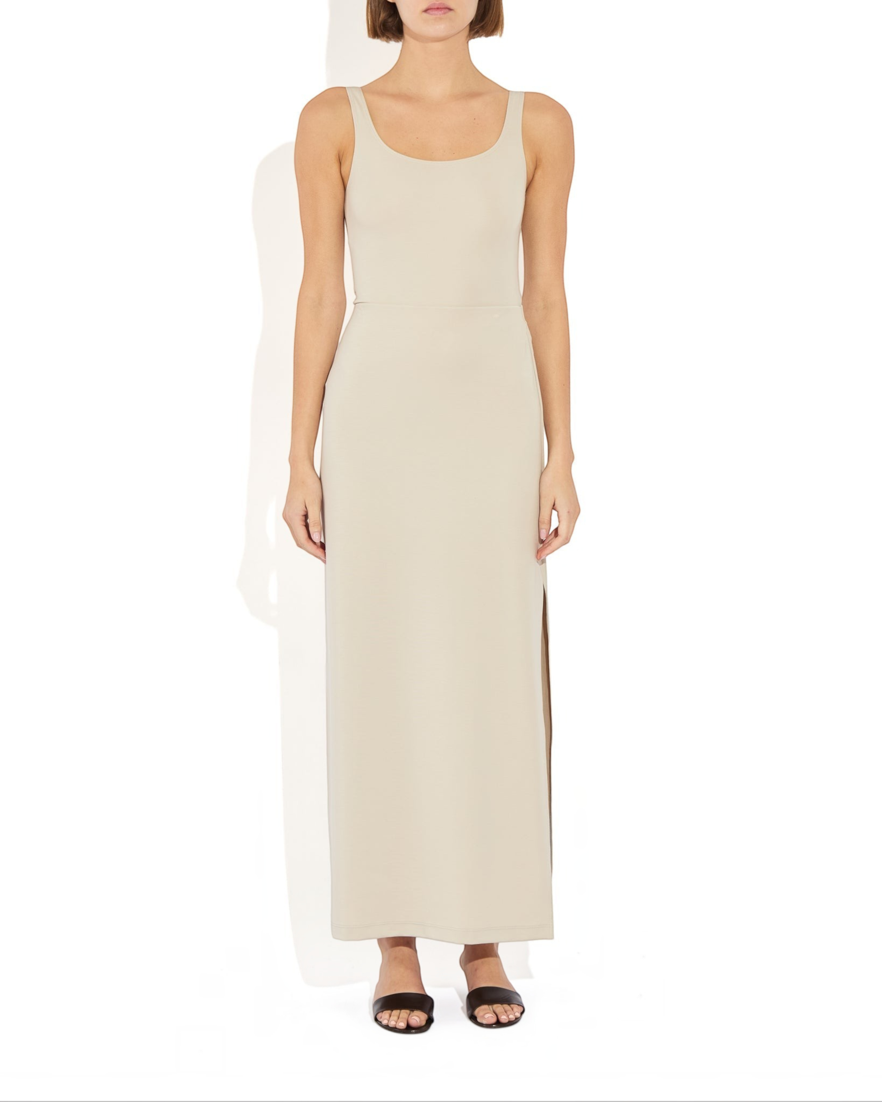 Weldun Ashley Skirt in beige, a minimal column silhouette with a side slit made from soft stretch PYRATEX fabric.