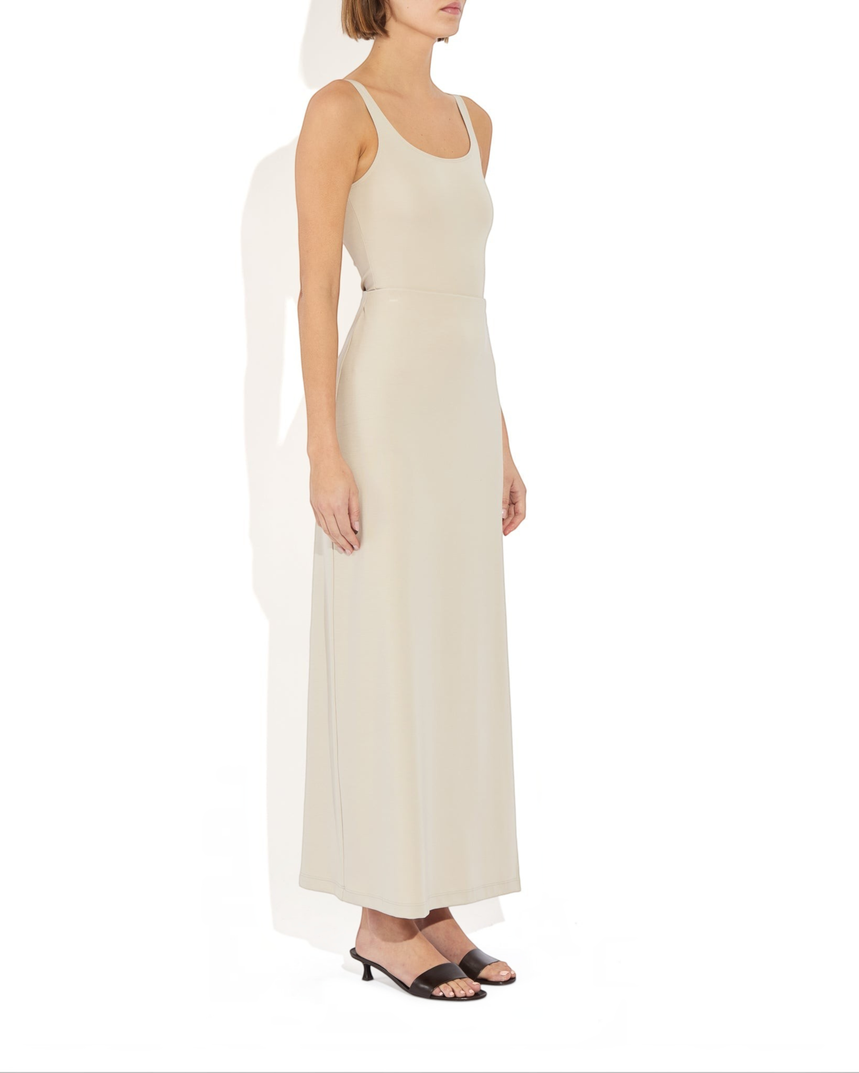 Weldun Ashley Skirt in beige, a minimal column silhouette with a side slit, made from soft stretch PYRATEX fabric.