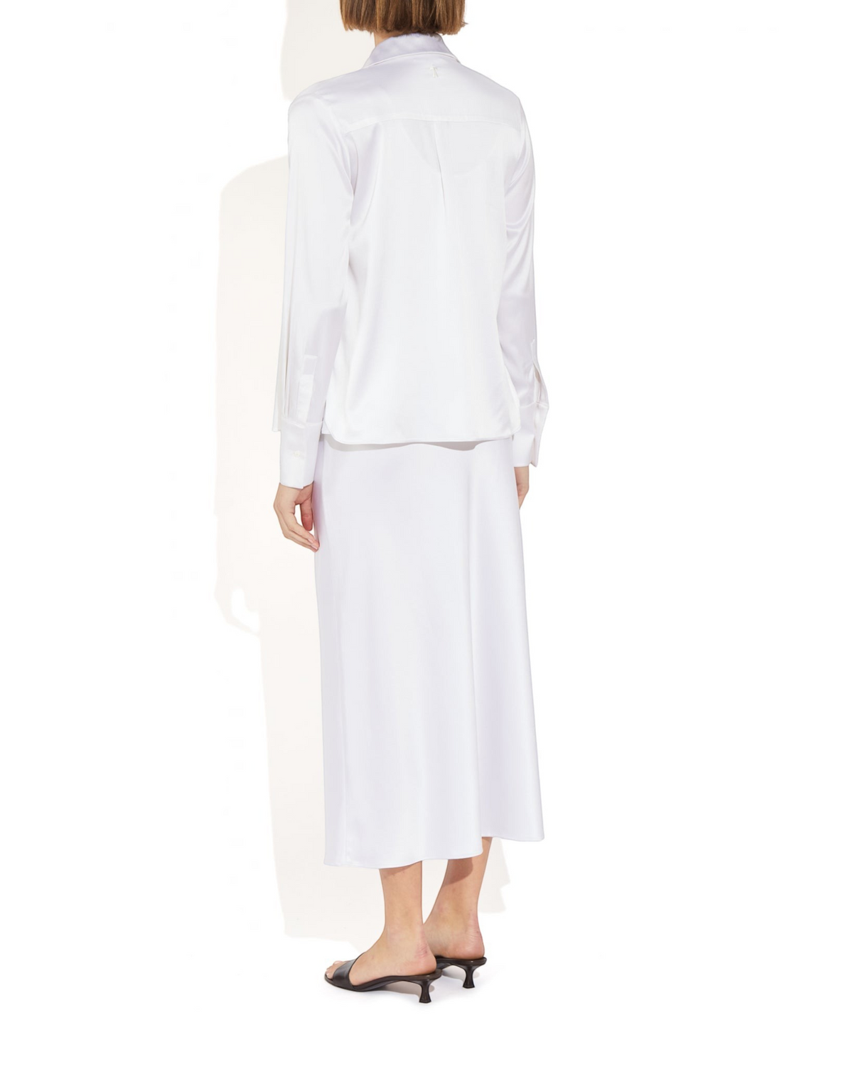 Weldun Bonnie Blouse in white stretch silk with long sleeves and a relaxed fit, shown from the back view.