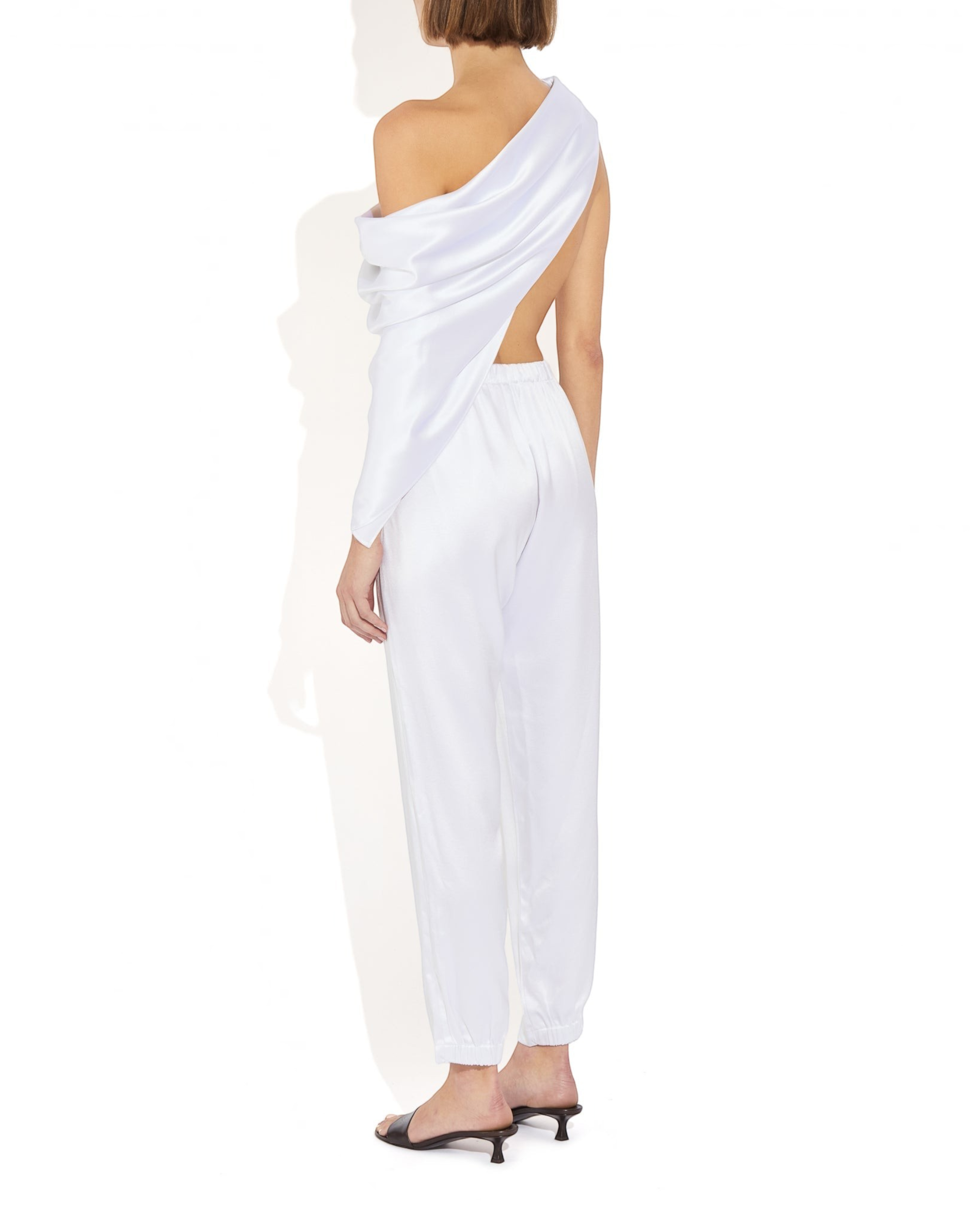 Weldun Rebecca Jogger in white mulberry silk with elastic waistband and tapered leg, shown from the back view.
