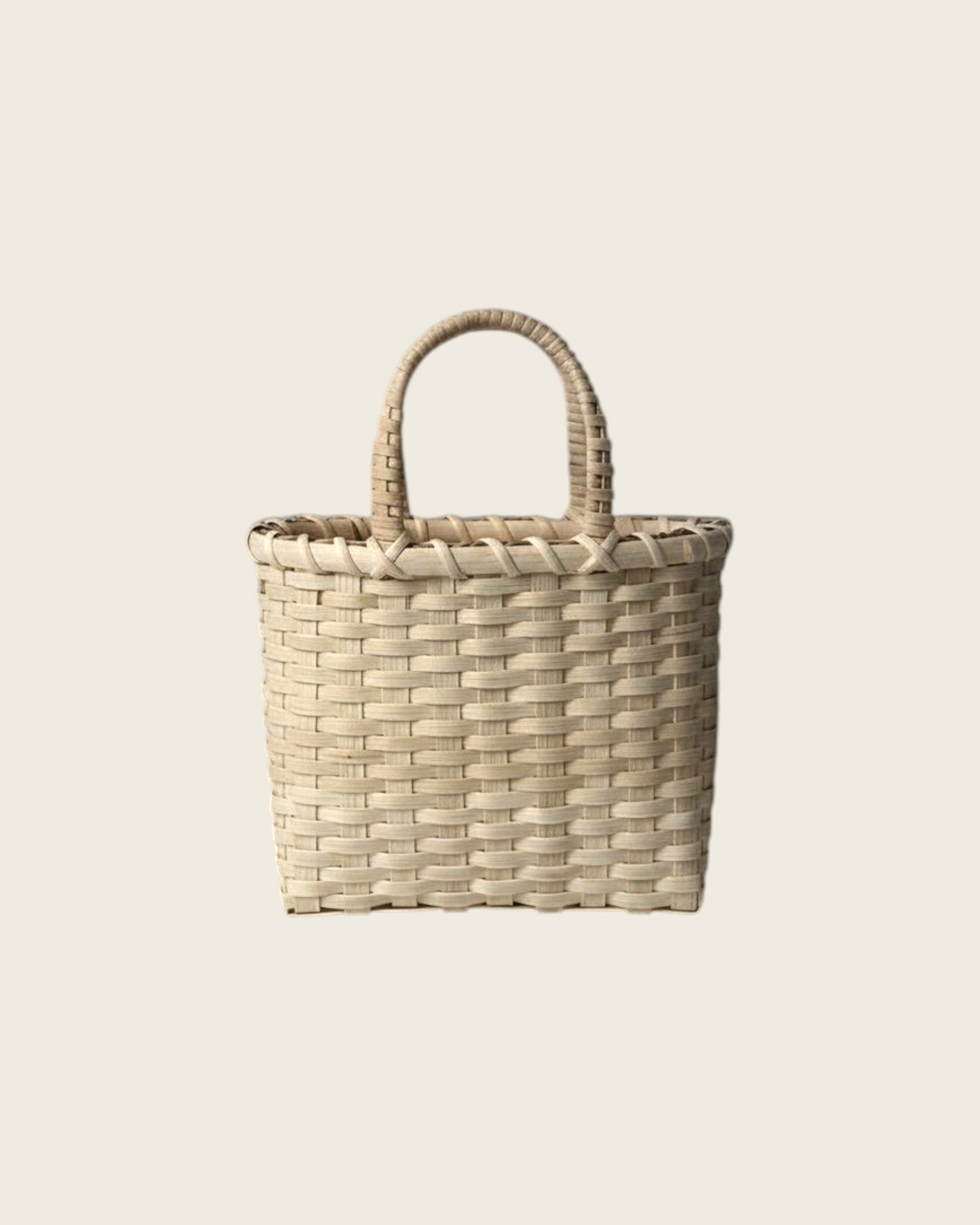 Weldun Little Shopper hand-woven rattan basket with wrapped handles in a natural light beige finish