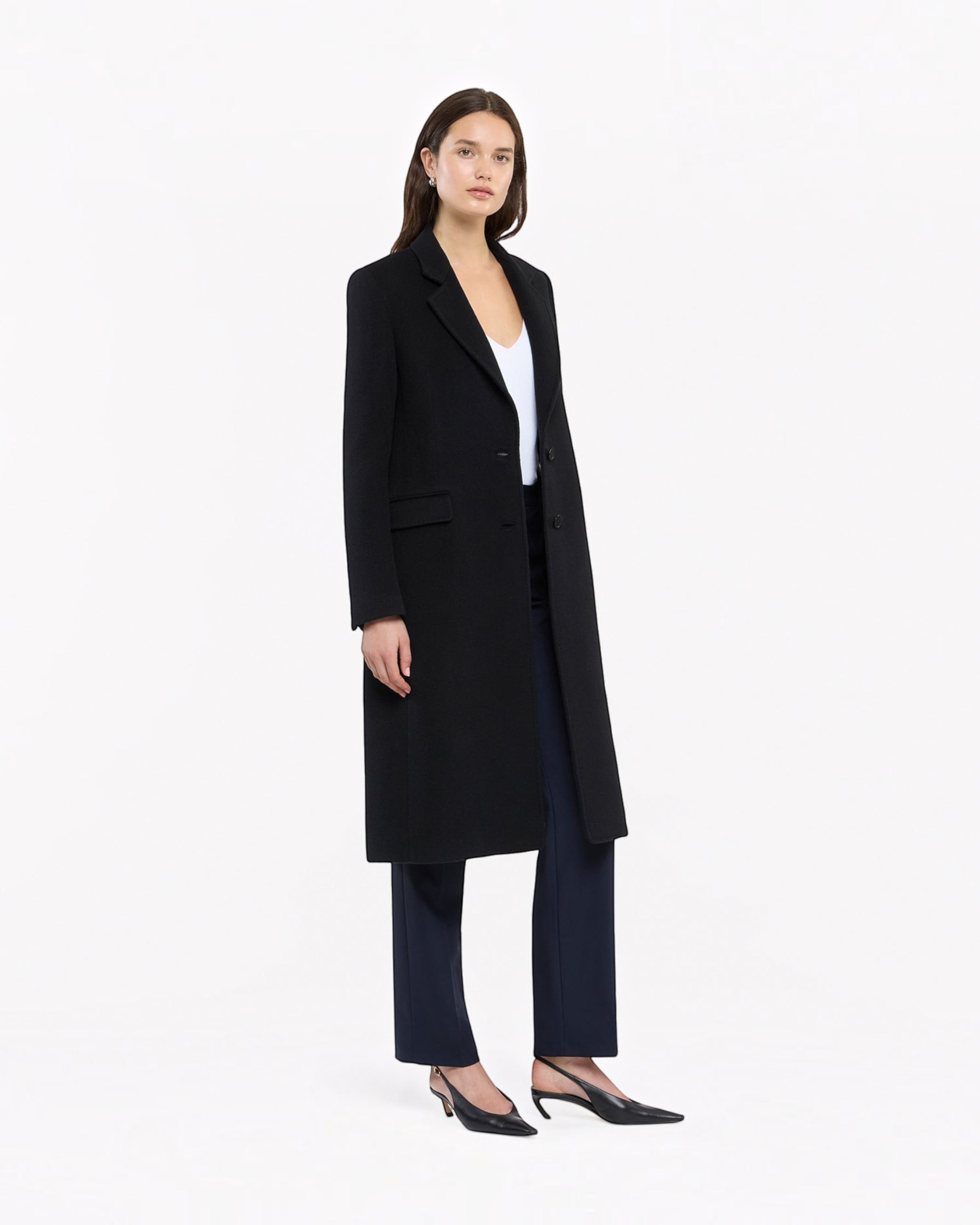 Weldun black cashmere tailored overcoat worn by a model with a white top and dark trousers