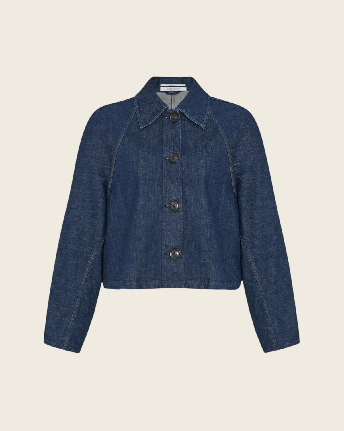 Weldun indigo blue organic cotton denim blouson jacket with a cropped length, point collar, and button-front closure.