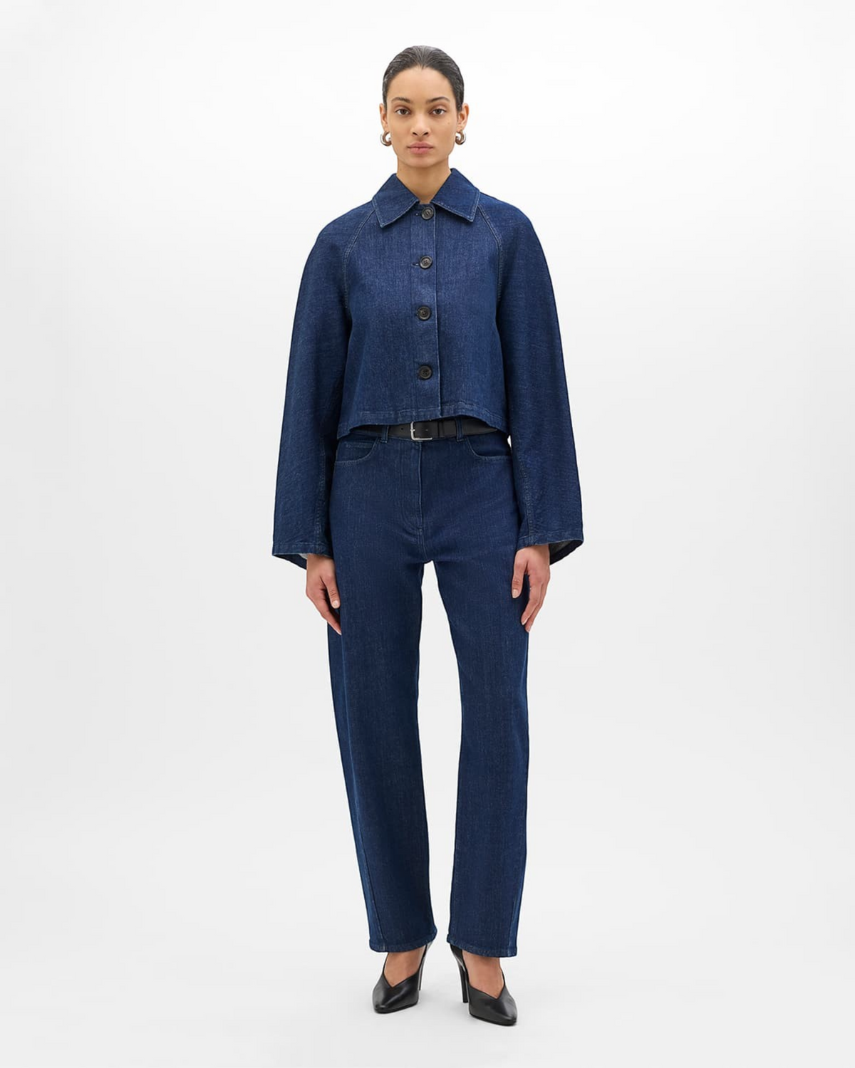 Weldun Another Tomorrow indigo denim blouson with a cropped, oversized fit and point collar worn by a model.