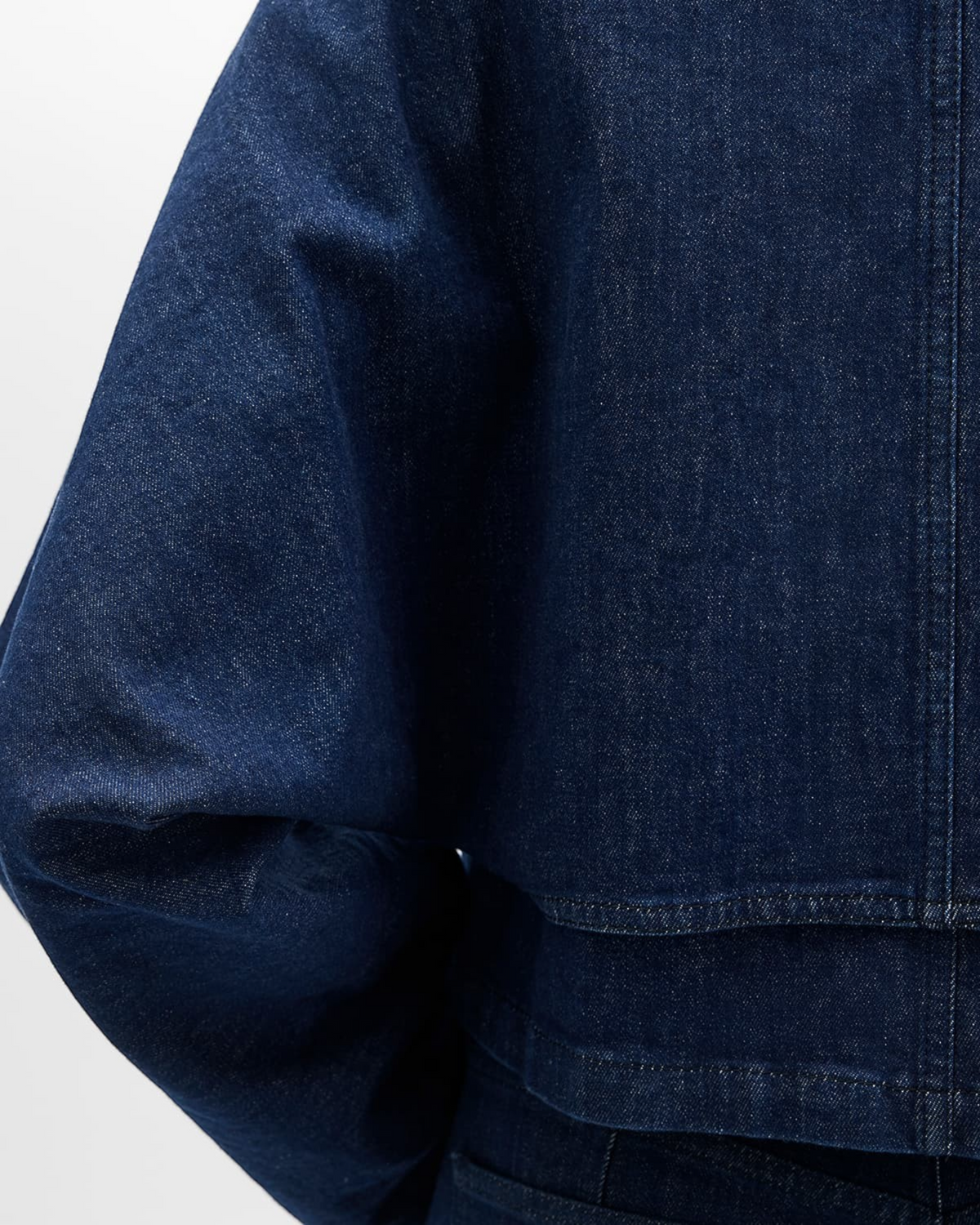Weldun indigo blue organic cotton denim blouson jacket featuring refined topstitching and a structured back layer