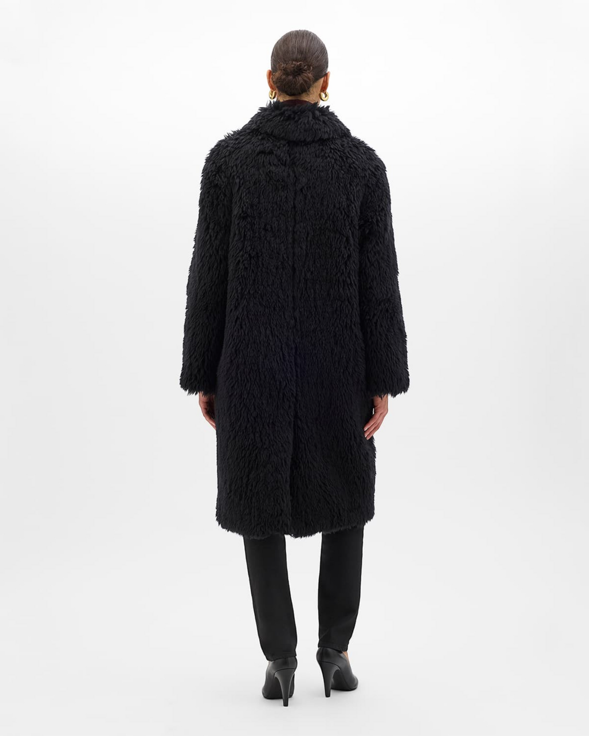 Weldun black faux fur Balmacaan coat with a relaxed, knee-length fit and back vent, shown from the rear view.