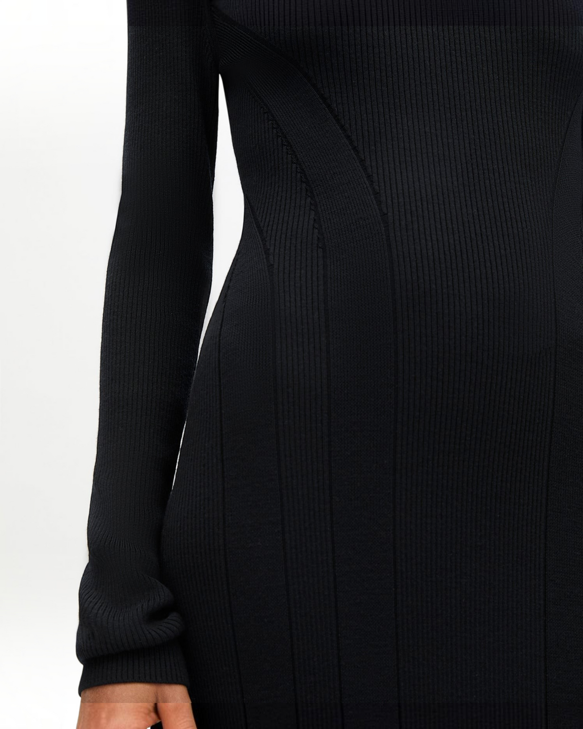 Weldun black rib knit tea length dress featuring soft wool fabric, contouring fit, and curved seaming details.