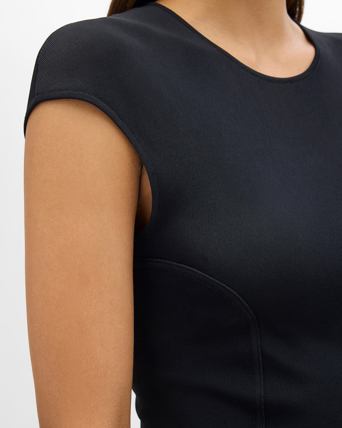 Weldun black fitted jersey top featuring curved seaming details and a cap sleeve design for a sculpted silhouette.