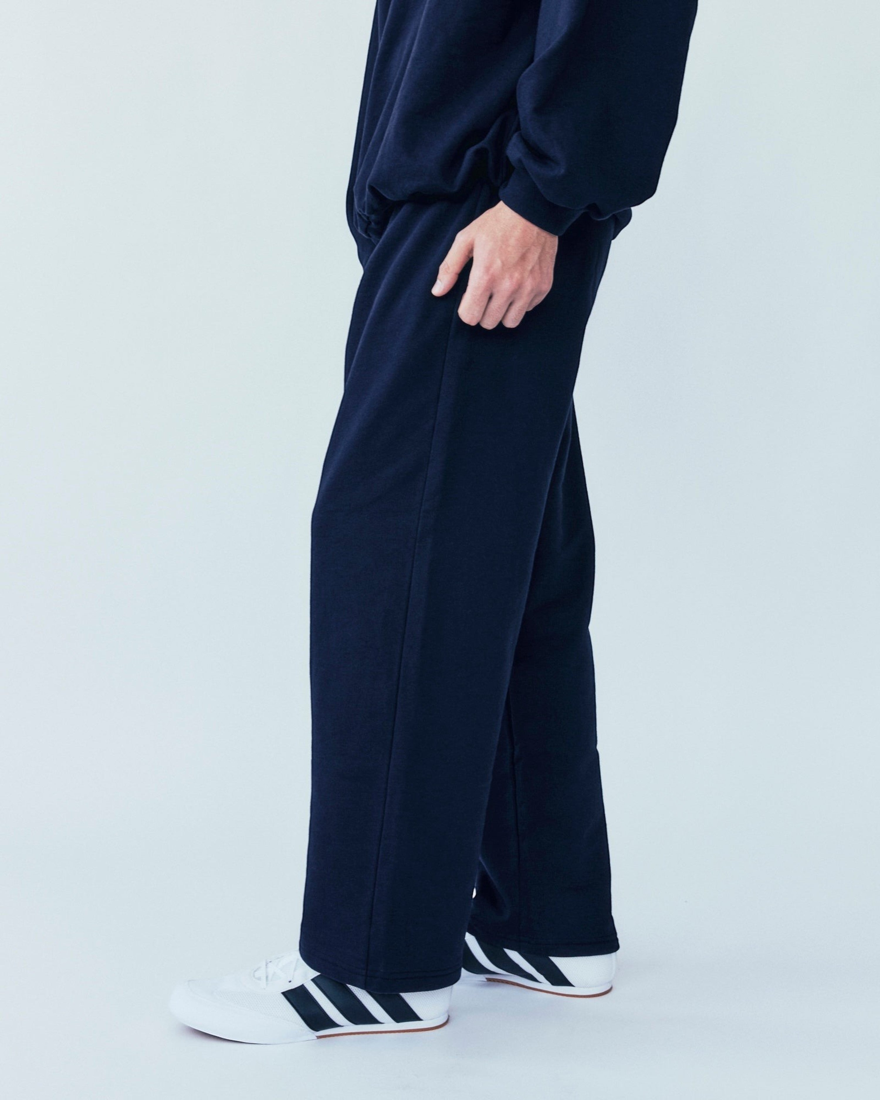 Weldun navy organic cotton sweatpants with a relaxed straight-leg fit and adjustable elastic waistband