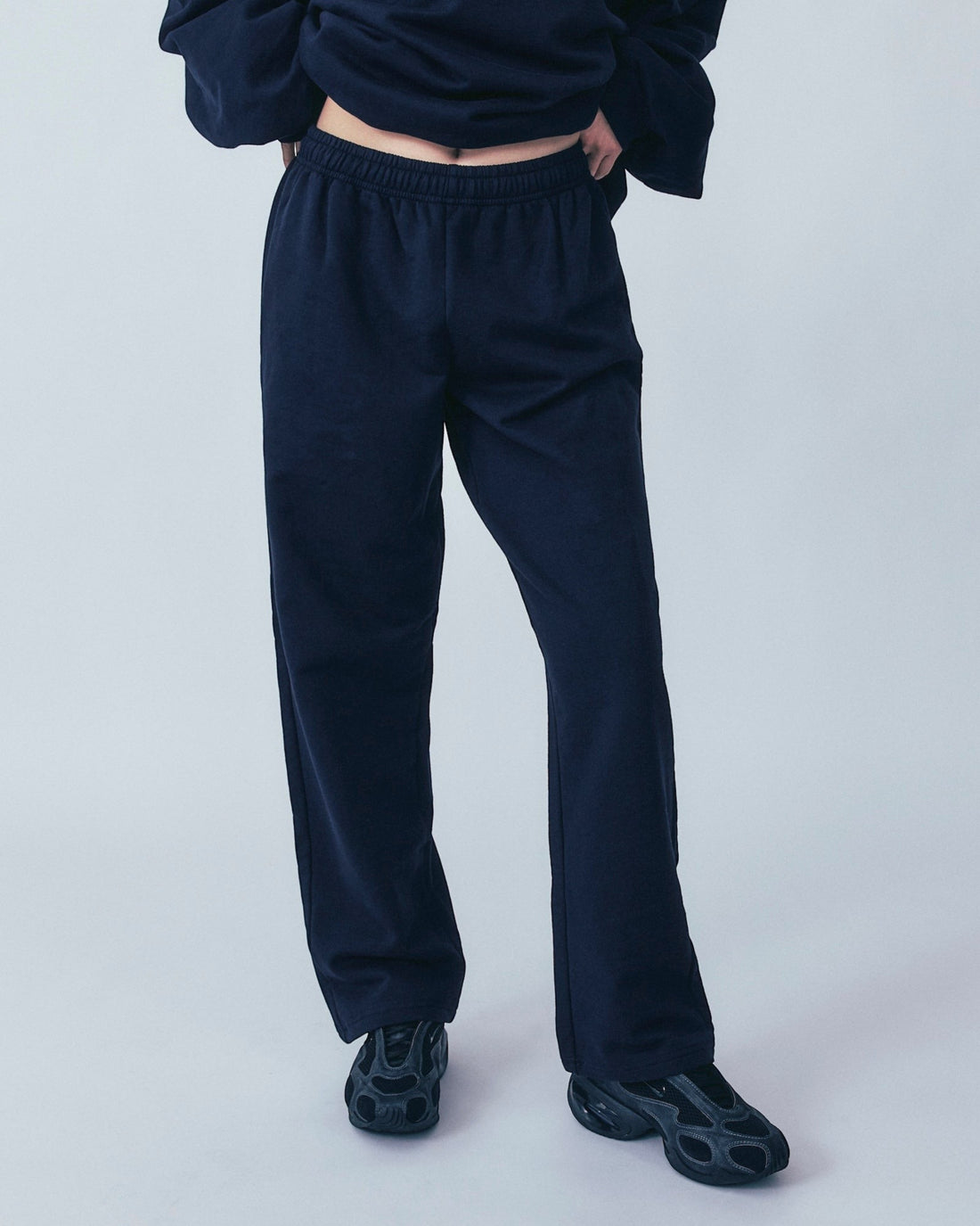 Weldun navy organic cotton sweatpants with a relaxed straight-leg fit and comfortable elastic waistband
