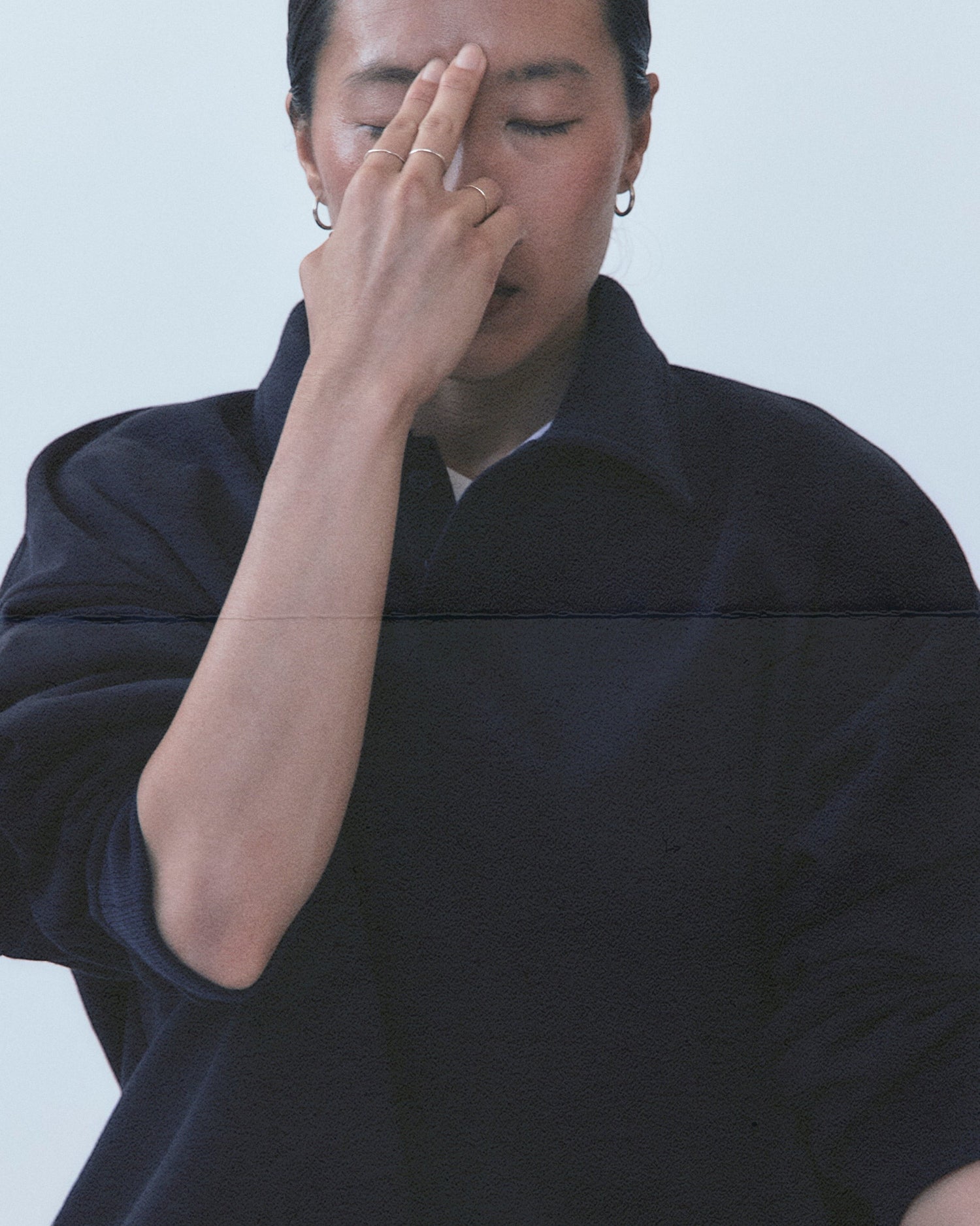 Weldun navy cotton polo sweatshirt with a high-neck ribbed collar and relaxed boxy fit worn by a model.