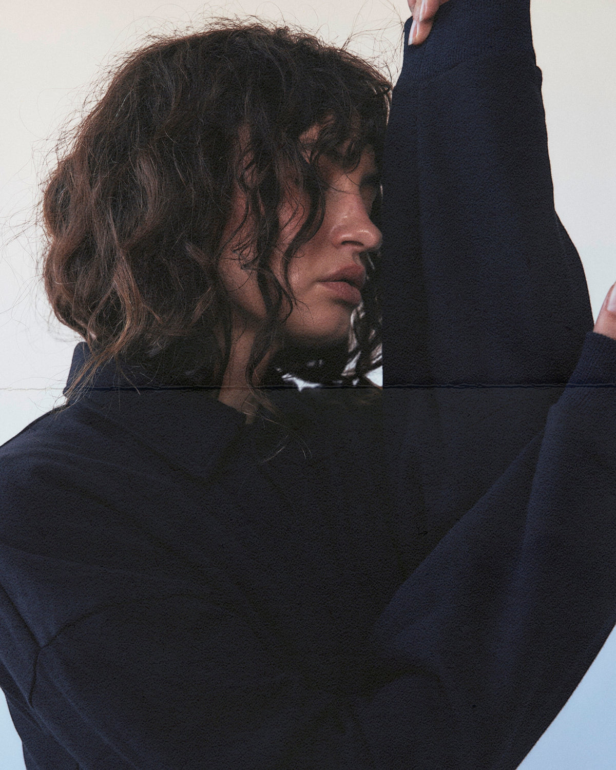 Weldun navy cotton polo sweatshirt with a high-neck ribbed collar and oversized fit worn by a woman
