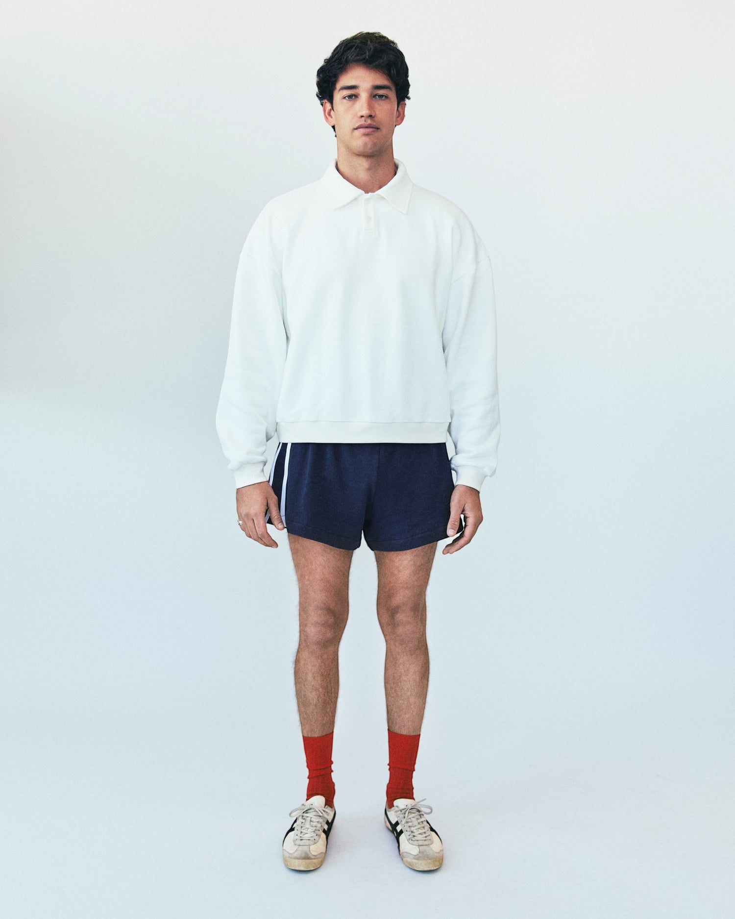 Weldun H-O-R-S-E white oversized cotton polo sweatshirt with ribbed collar and cuffs worn by a male model