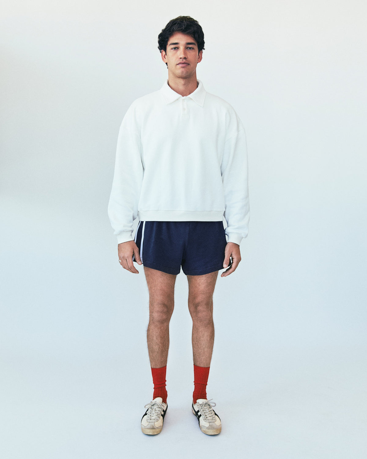Weldun H-O-R-S-E white oversized cotton polo sweatshirt with ribbed collar and cuffs worn by a male model