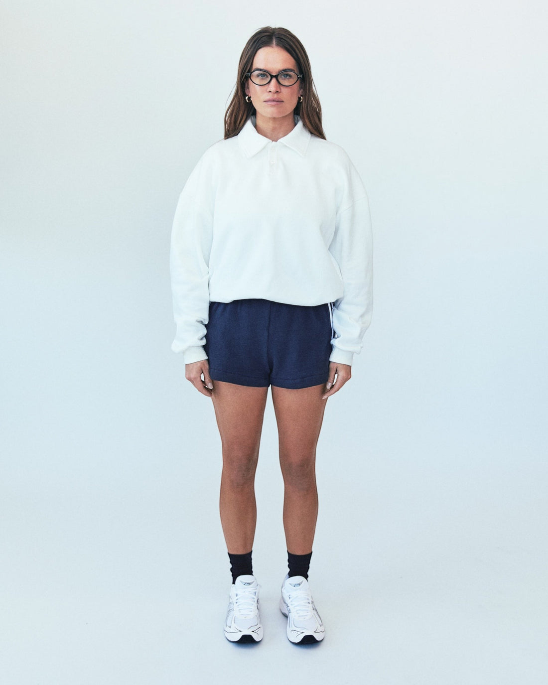 Weldun H-O-R-S-E white oversized cotton polo sweatshirt with ribbed collar and cuffs worn by a woman