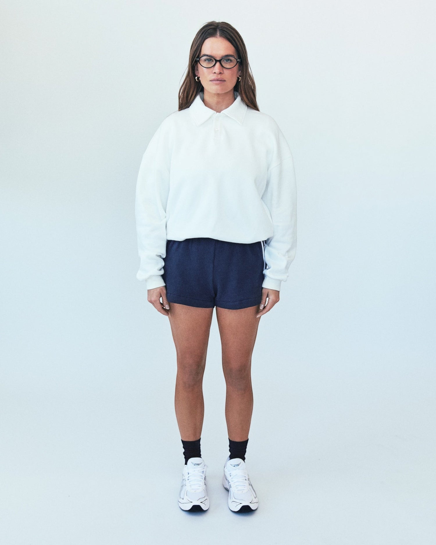 Weldun H-O-R-S-E white oversized cotton polo sweatshirt with ribbed collar and cuffs worn by a woman