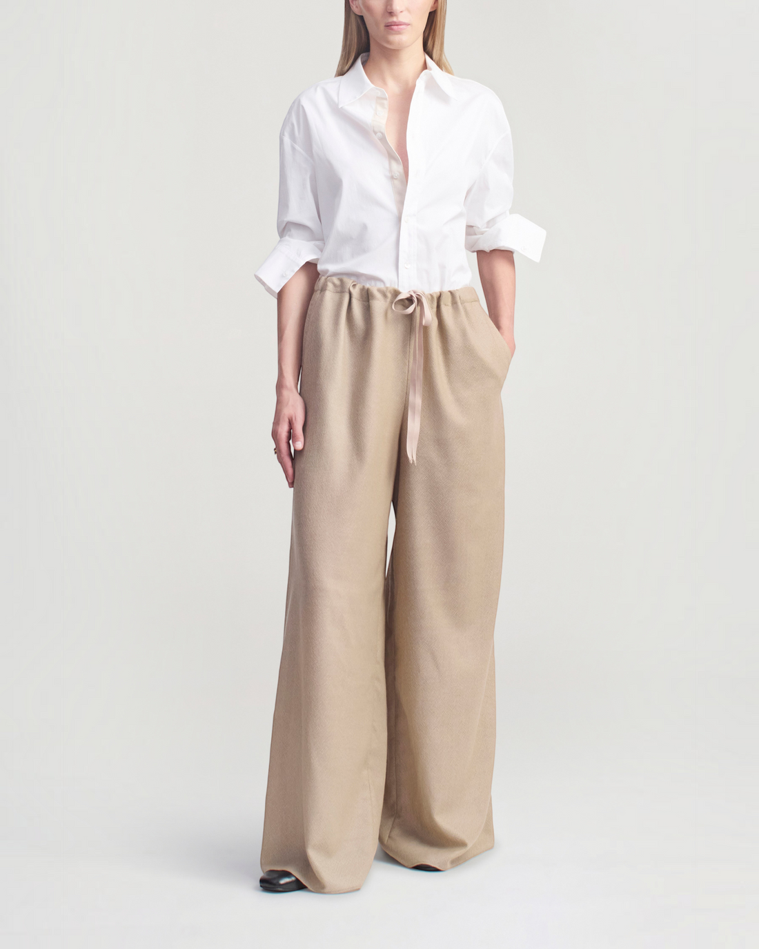 Weldun Cairo wide leg pants in taupe featherweight wool with an adjustable drawstring waistband and side pockets.