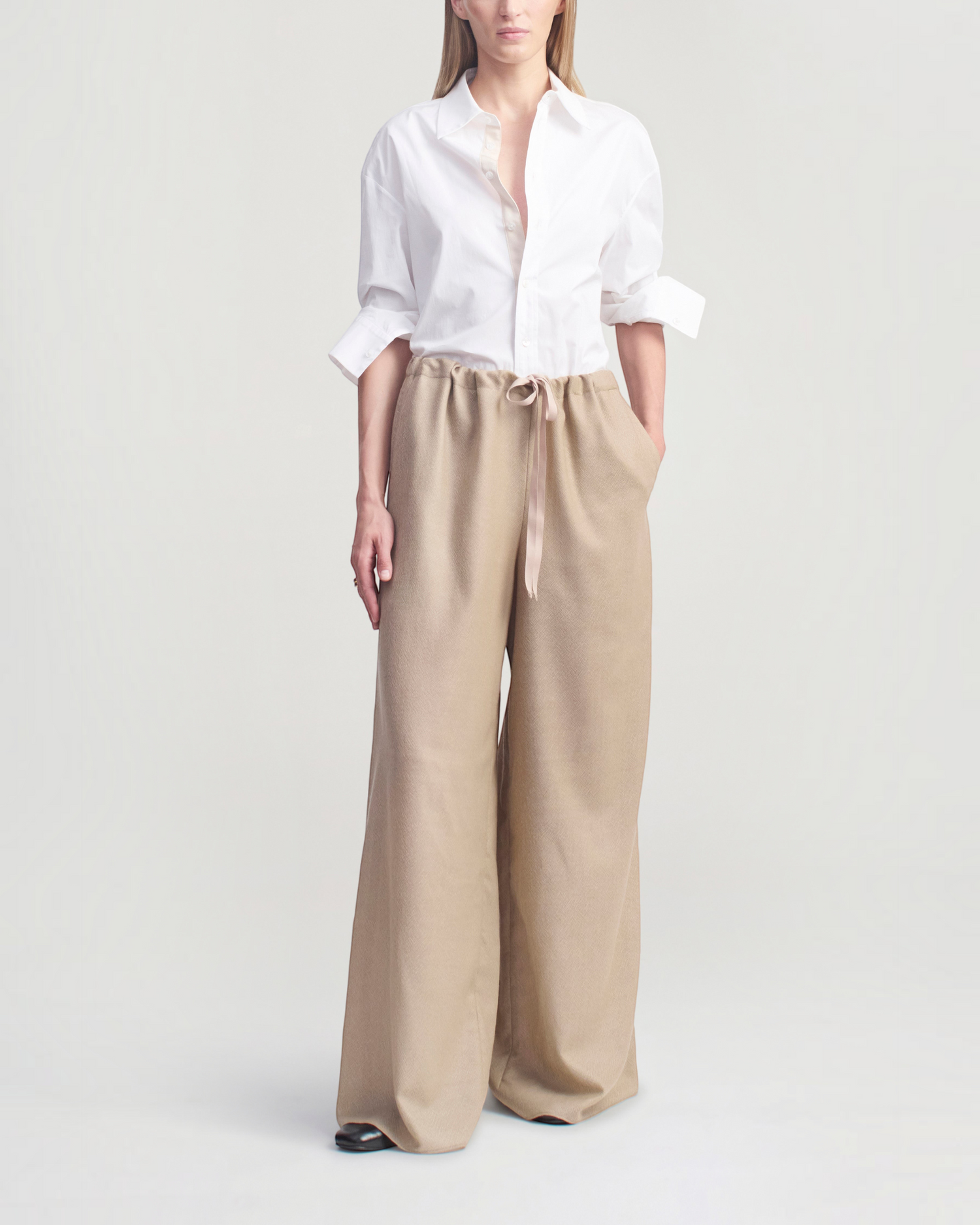 Weldun Cairo wide leg pants in taupe featherweight wool with an adjustable drawstring waistband and side pockets.