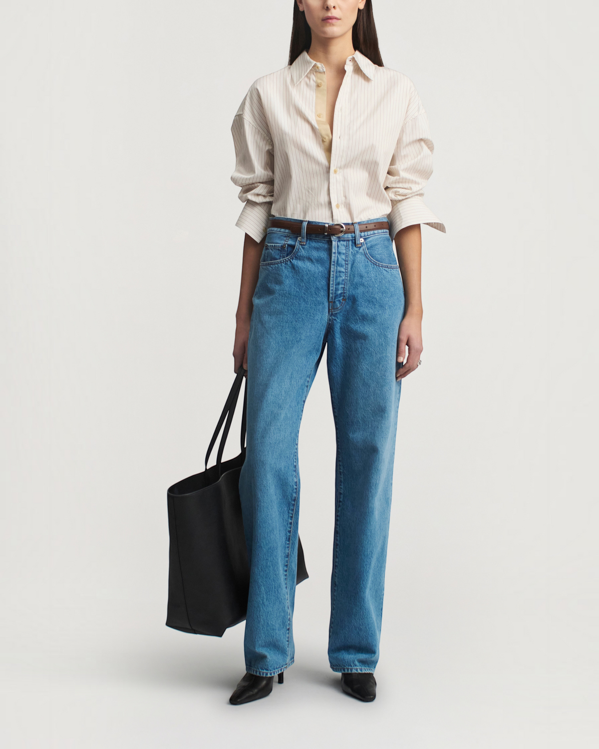 Weldun Dani button down shirt in sepia stripe cotton poplin worn with blue jeans and a black tote bag