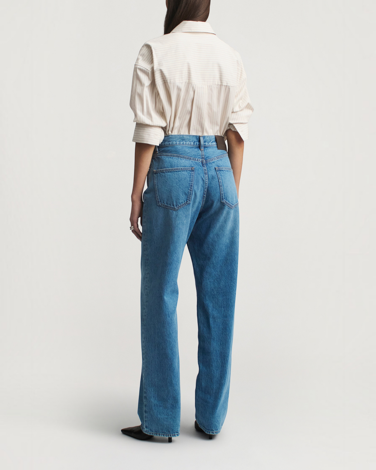 Weldun KALLMEYER Dani button down shirt in sepia stripe cotton poplin worn with blue jeans, back view