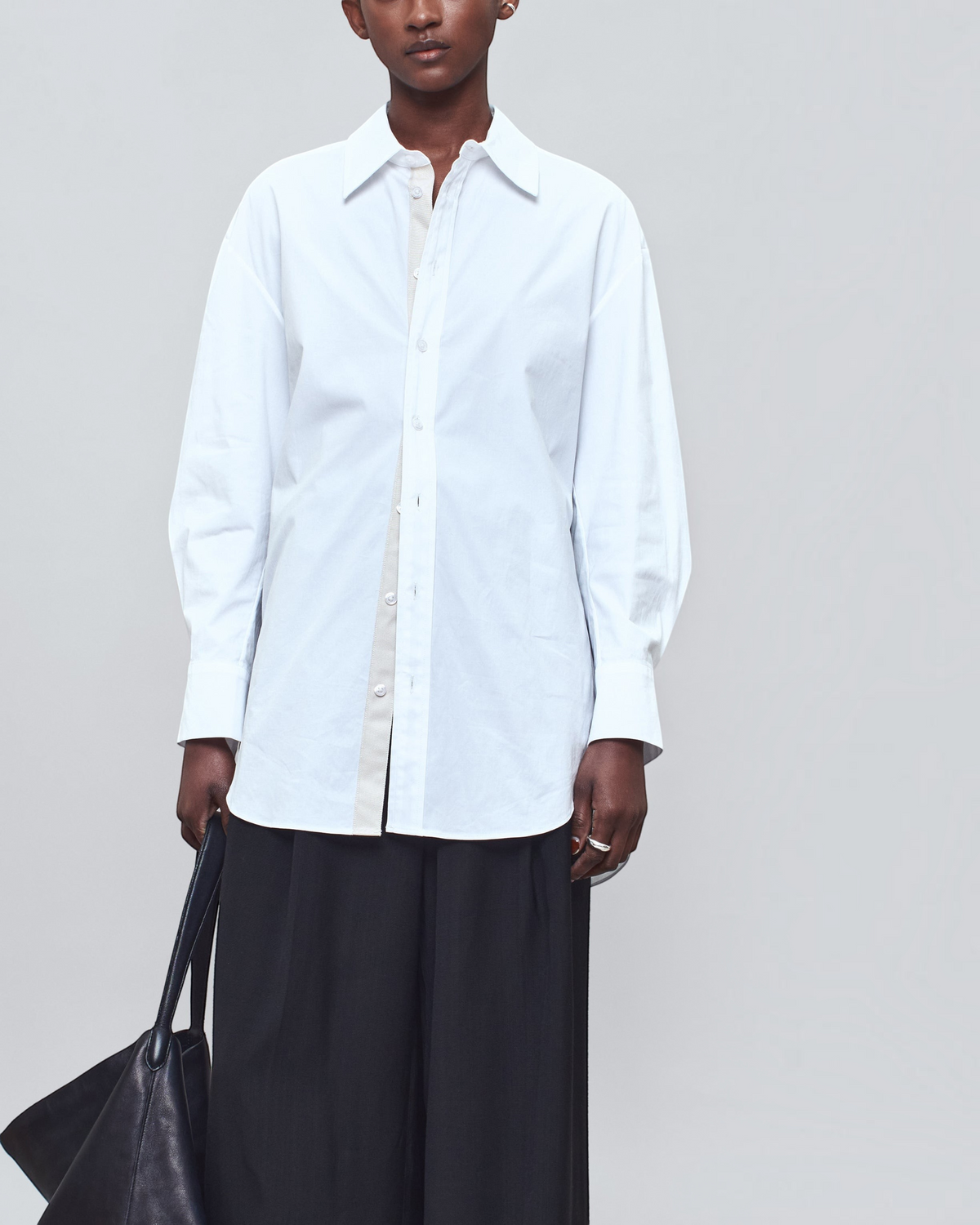 Weldun Dani button down shirt in white cotton poplin with a tonal grosgrain placket worn by a model