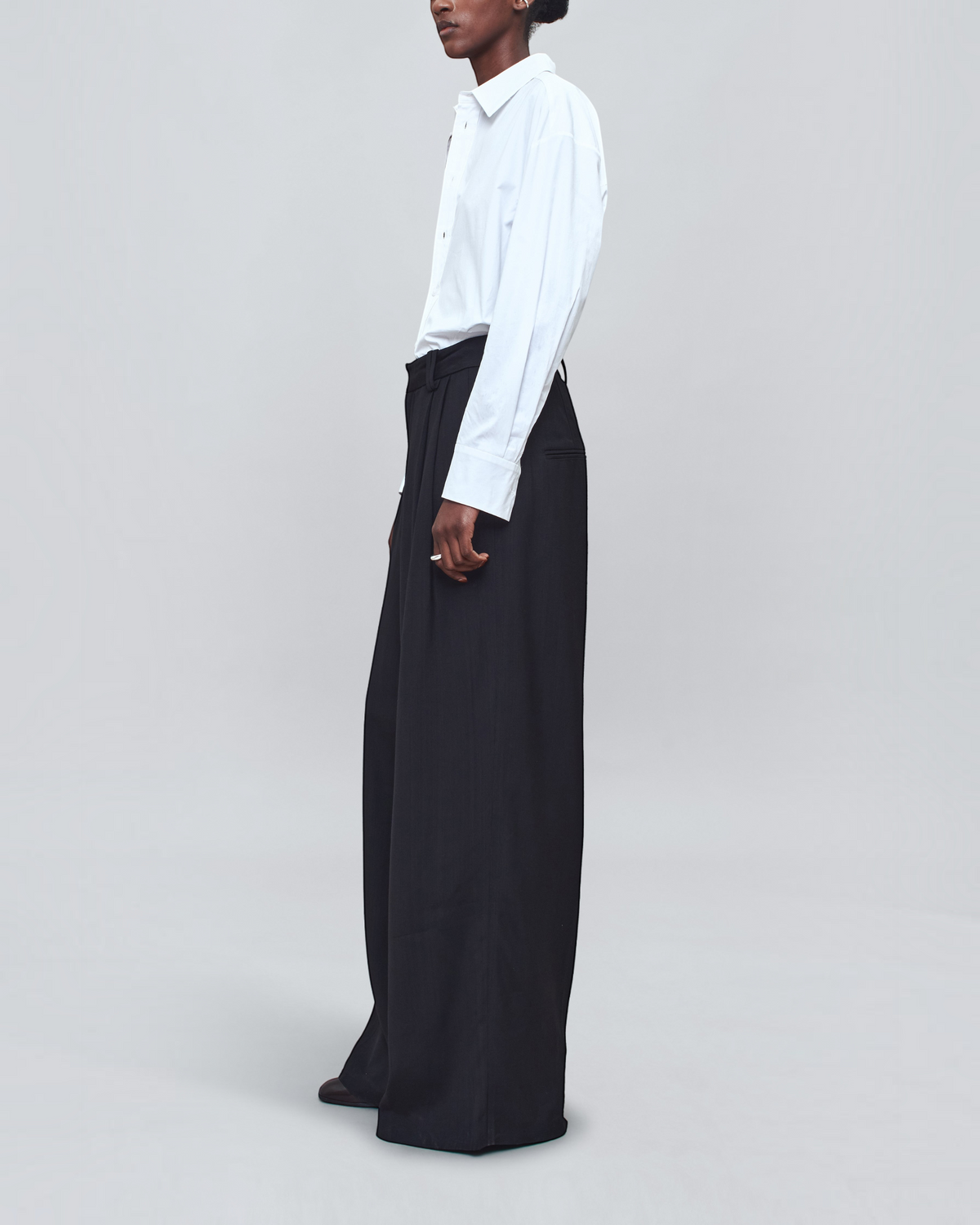 Weldun KALLMEYER Dani white cotton poplin button down shirt worn by a model with black wide-leg trousers