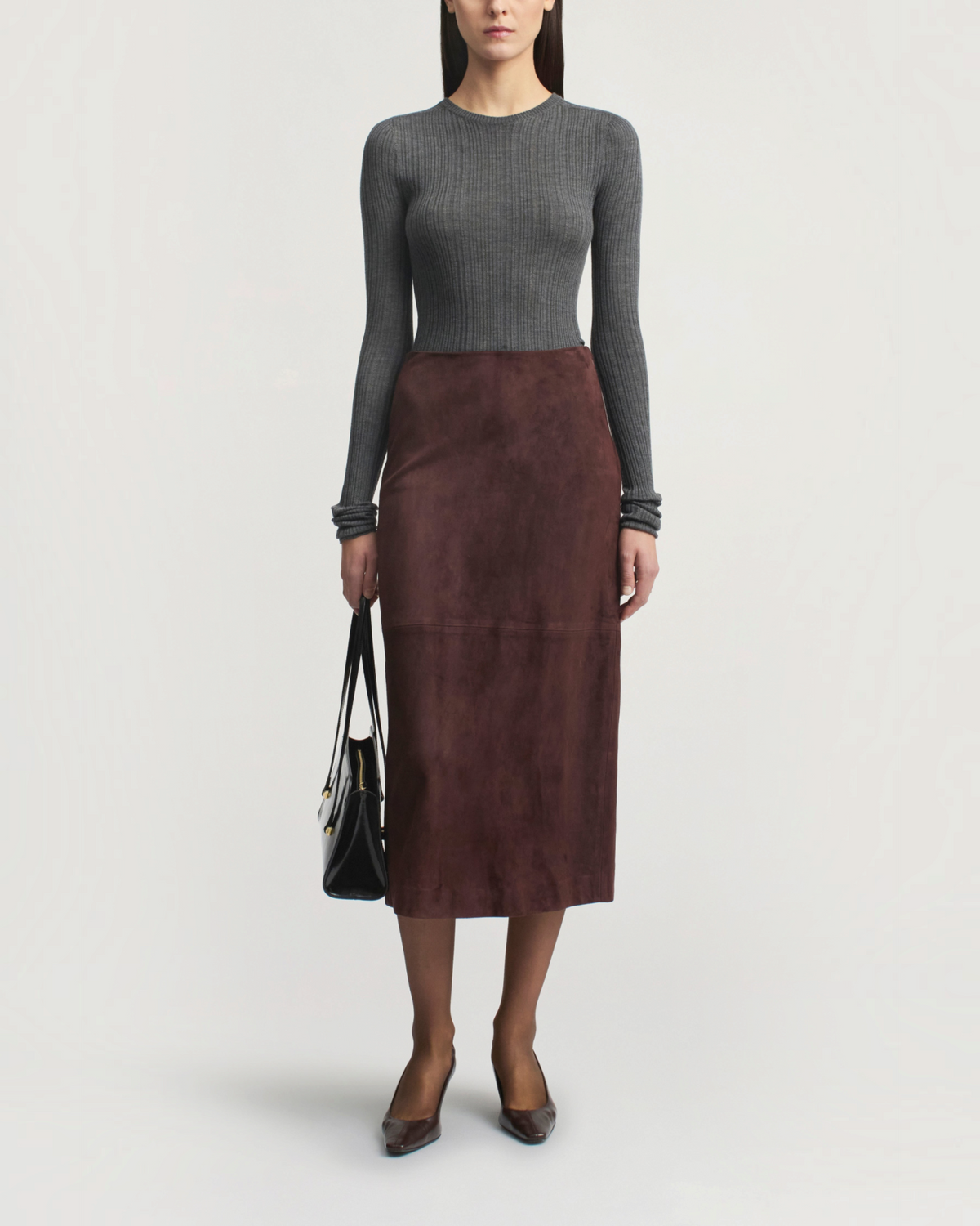 Weldun charcoal grey ribbed pointelle long sleeve top worn with a brown suede midi skirt and black handbag