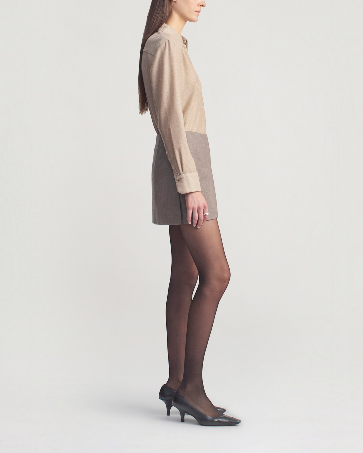 Weldun Joan bias-cut button-down shirt in taupe featherweight wool worn by a model in a side profile view.