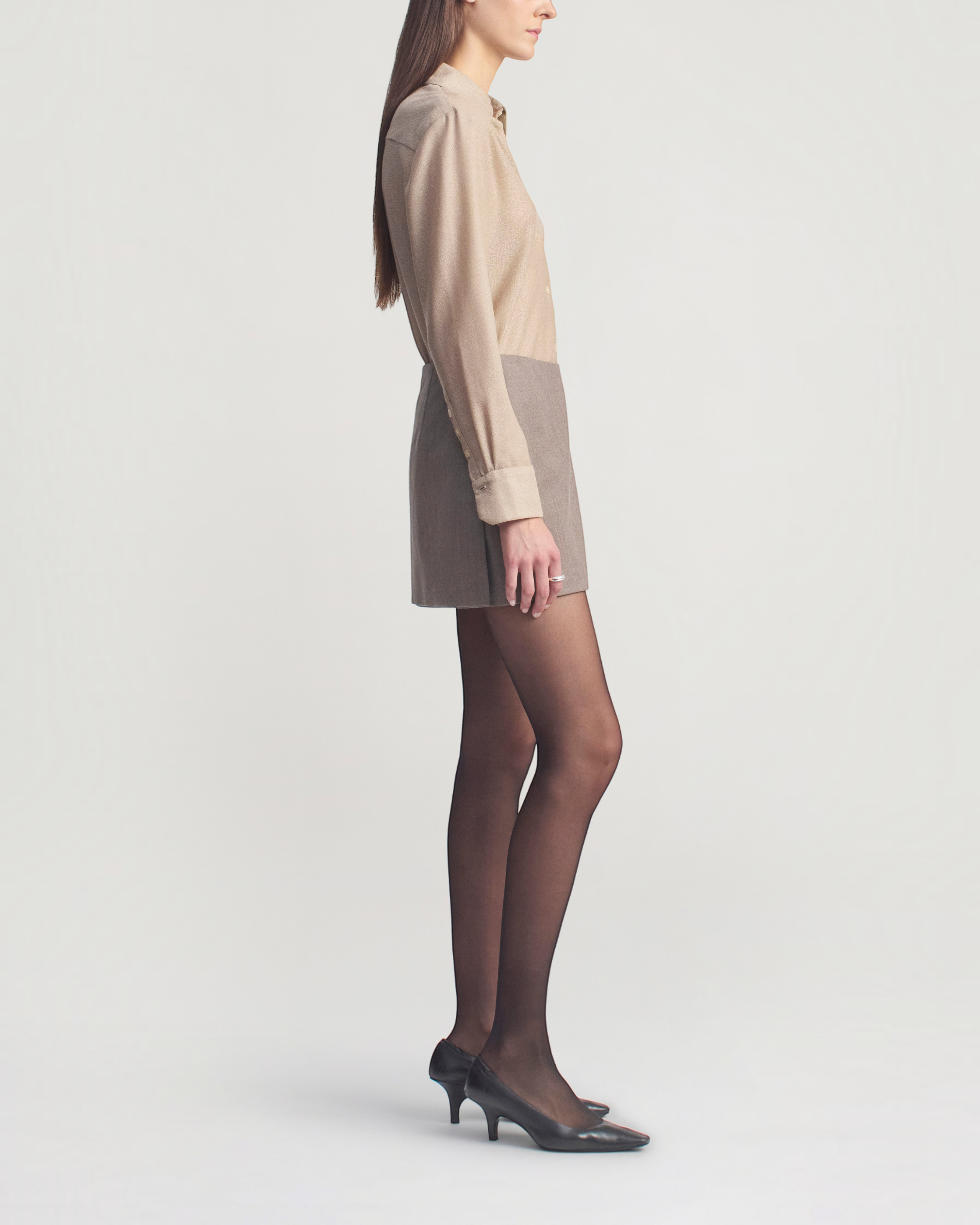 Weldun Joan bias-cut button-down shirt in taupe featherweight wool worn by a model in a side profile view.