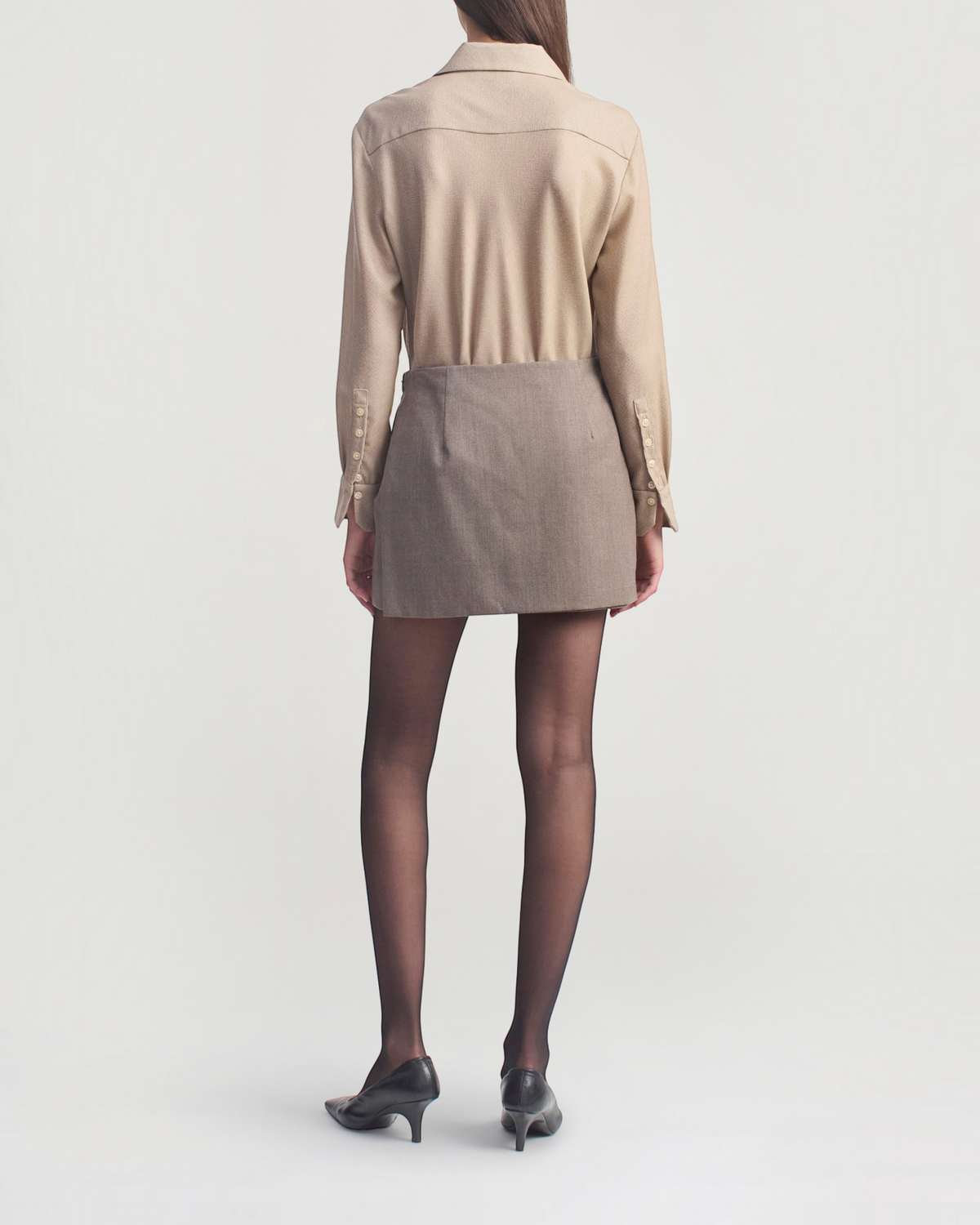 Weldun KALLMEYER Joan Bias Button Down in taupe featherweight wool worn with a mini skirt, back view