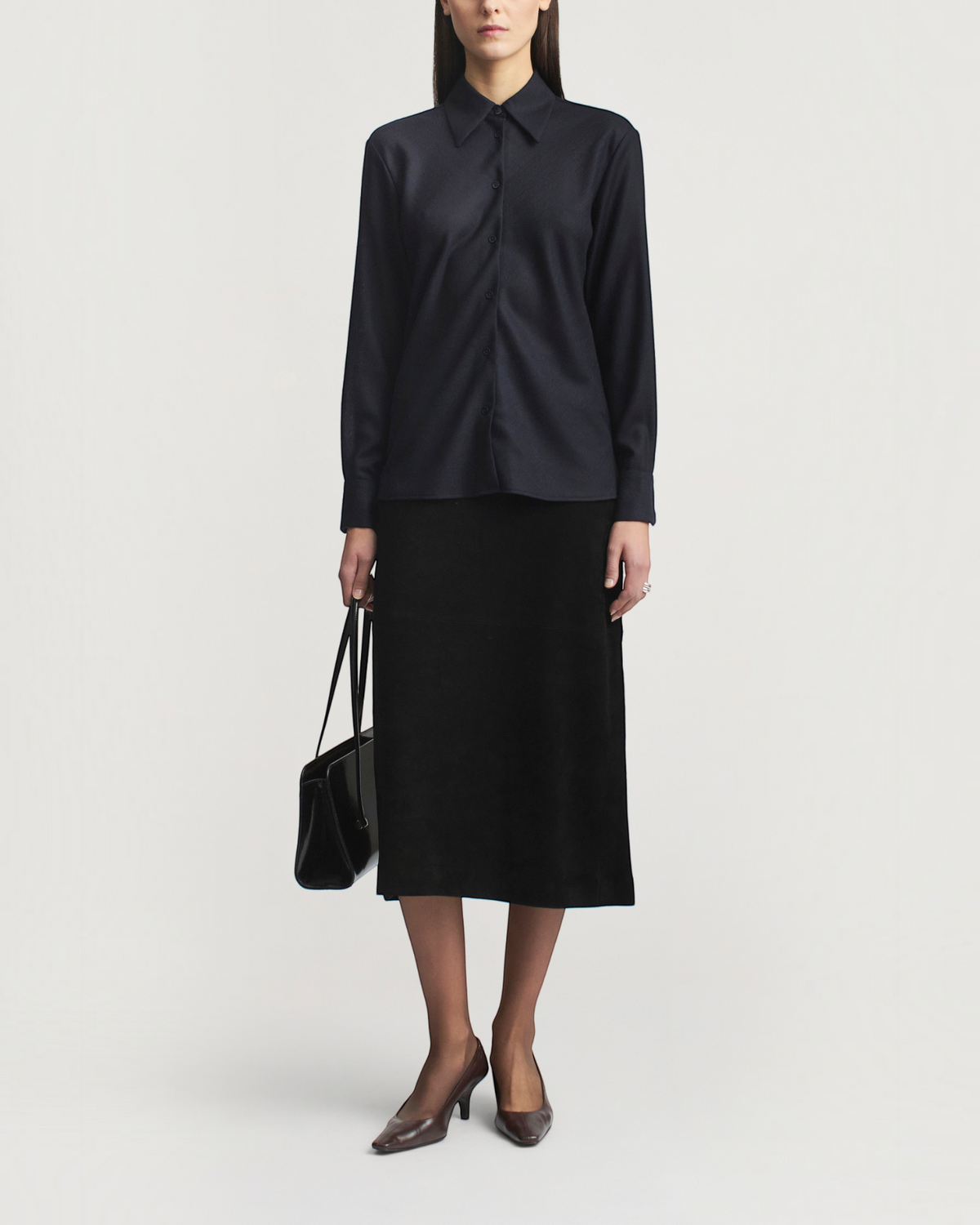 Weldun Joan bias button down shirt in indigo featherweight wool with point collar and long sleeves on a model