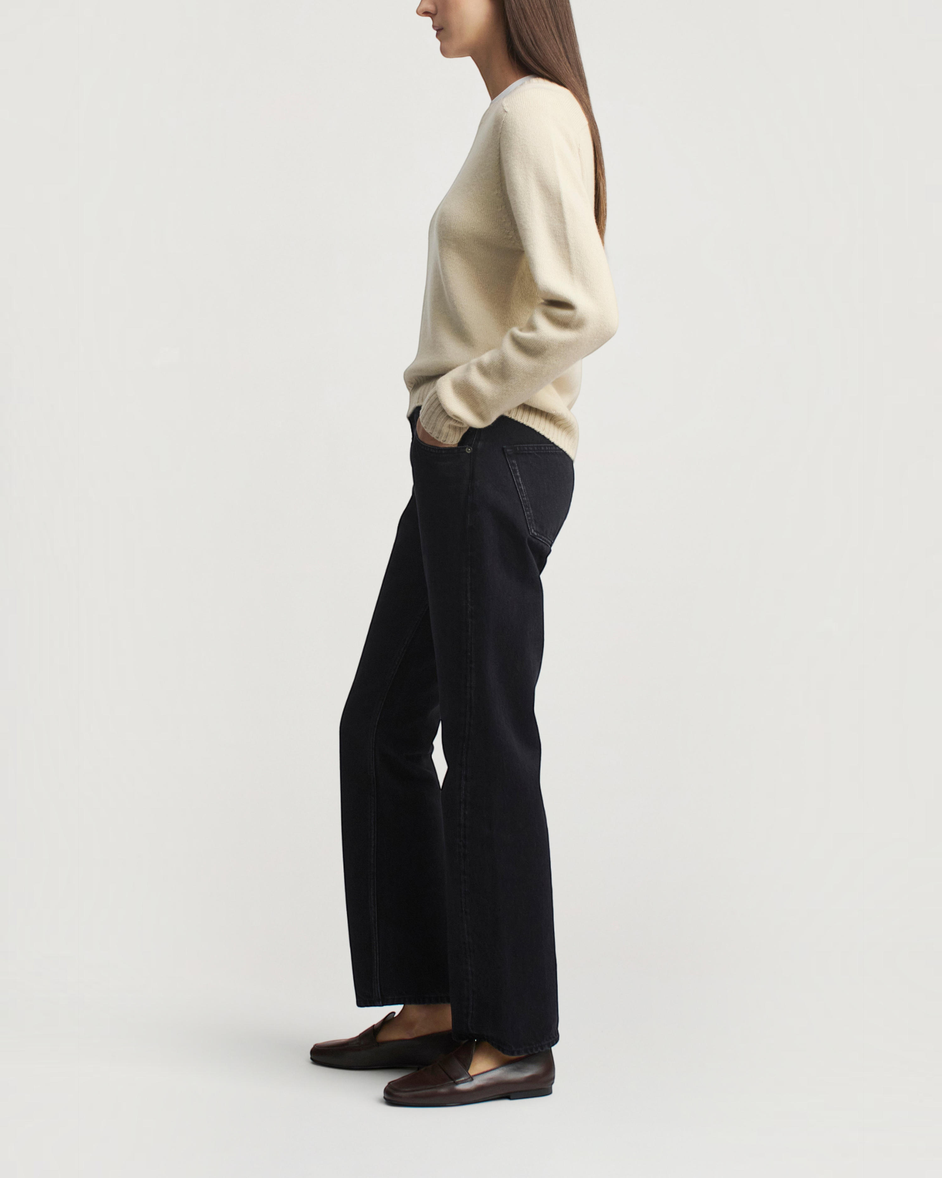 Weldun KALLMEYER Nina seamless crewneck sweater in birch wool cashmere with rib detailing, worn with black jeans.
