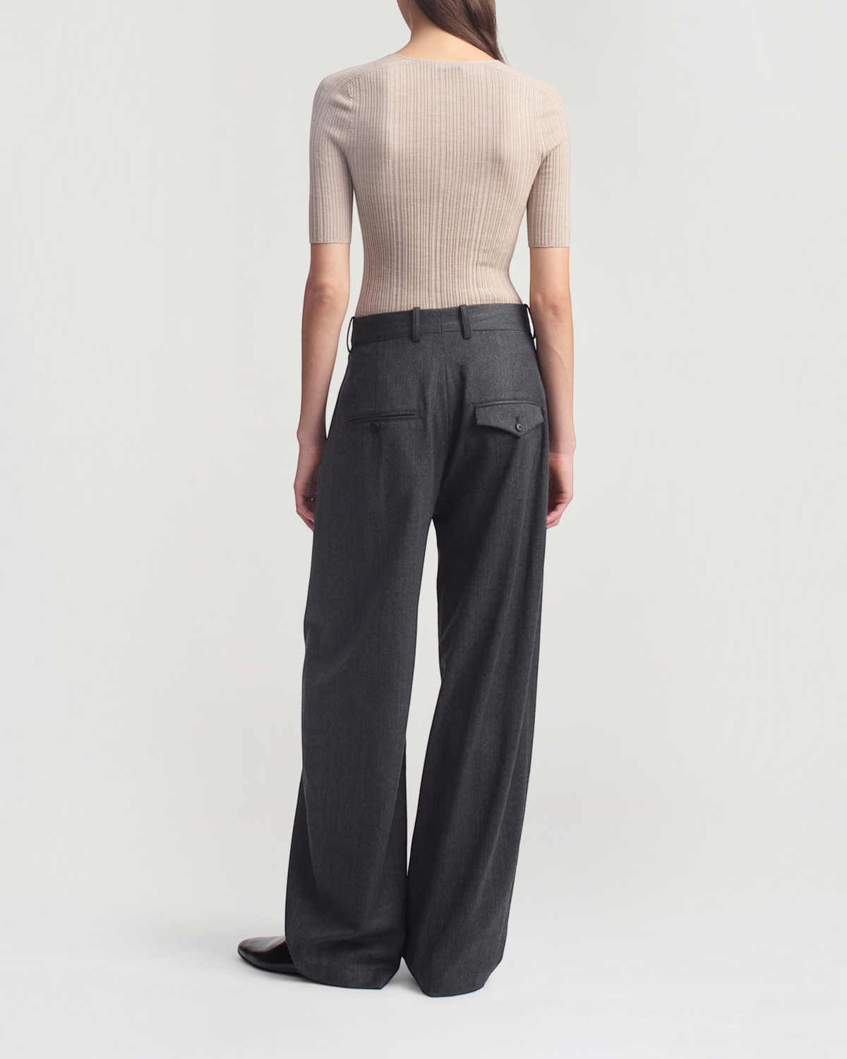 Weldun KALLMEYER Pika beige superfine pointelle knit top with elbow-length sleeves worn with dark grey trousers