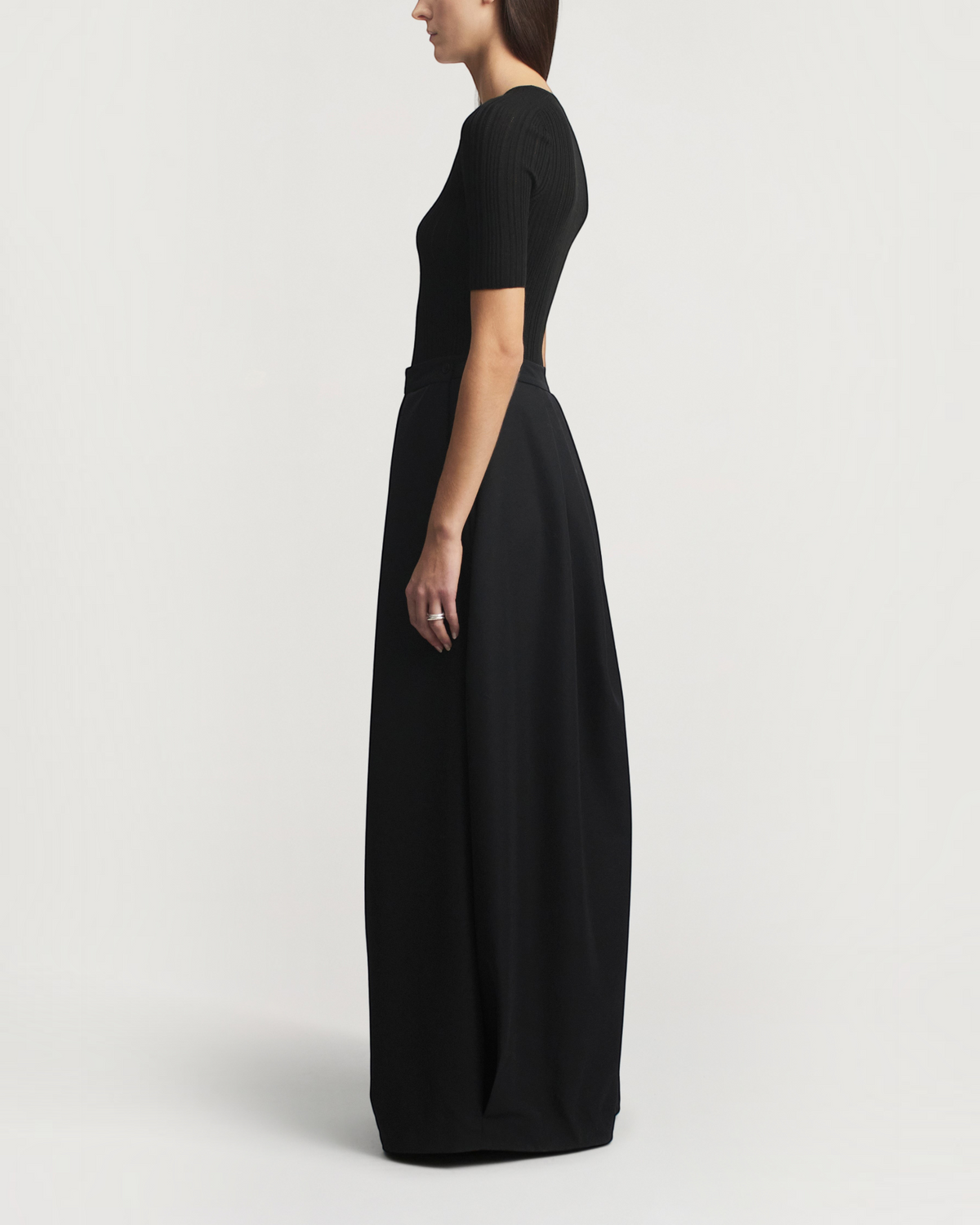 Weldun KALLMEYER Pika black superfine pointelle knit top with elbow-length sleeves and deep V-neck, side view.