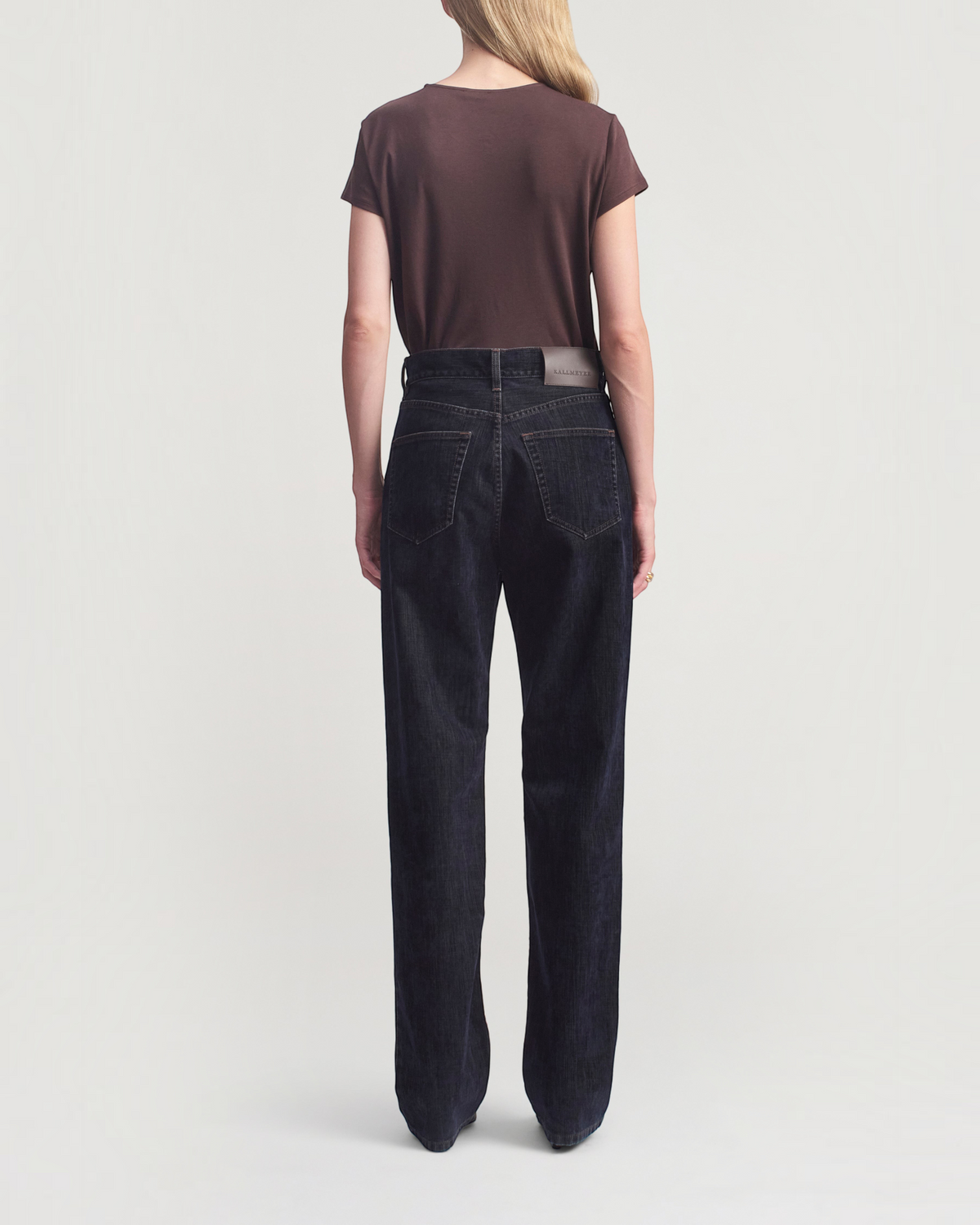 Weldun Willa Baby Tee in cacao brown cotton worn with dark wash denim jeans, back view