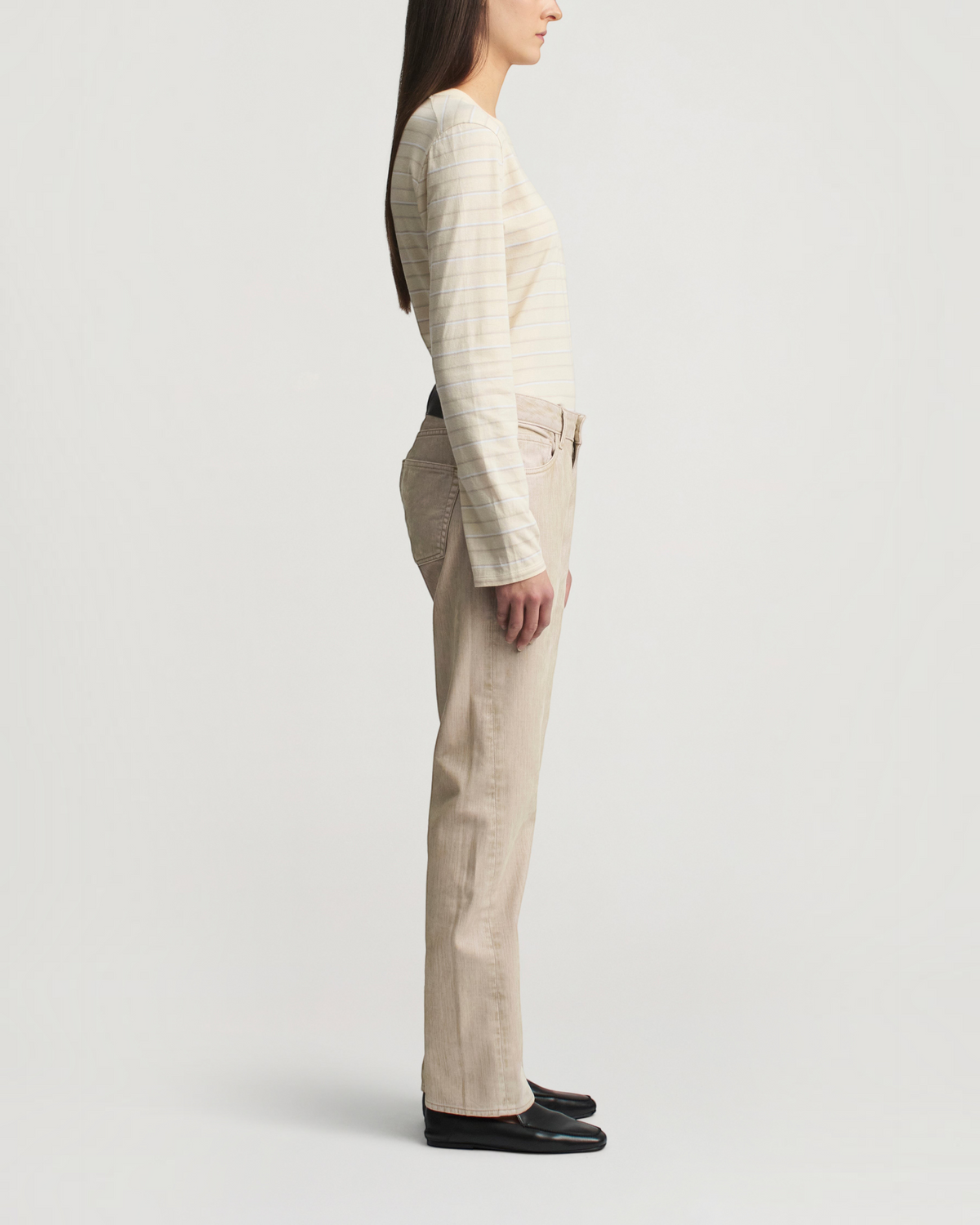 Weldun Wynn long sleeve t-shirt in ecru stripe with a relaxed fit worn by a model in profile view.