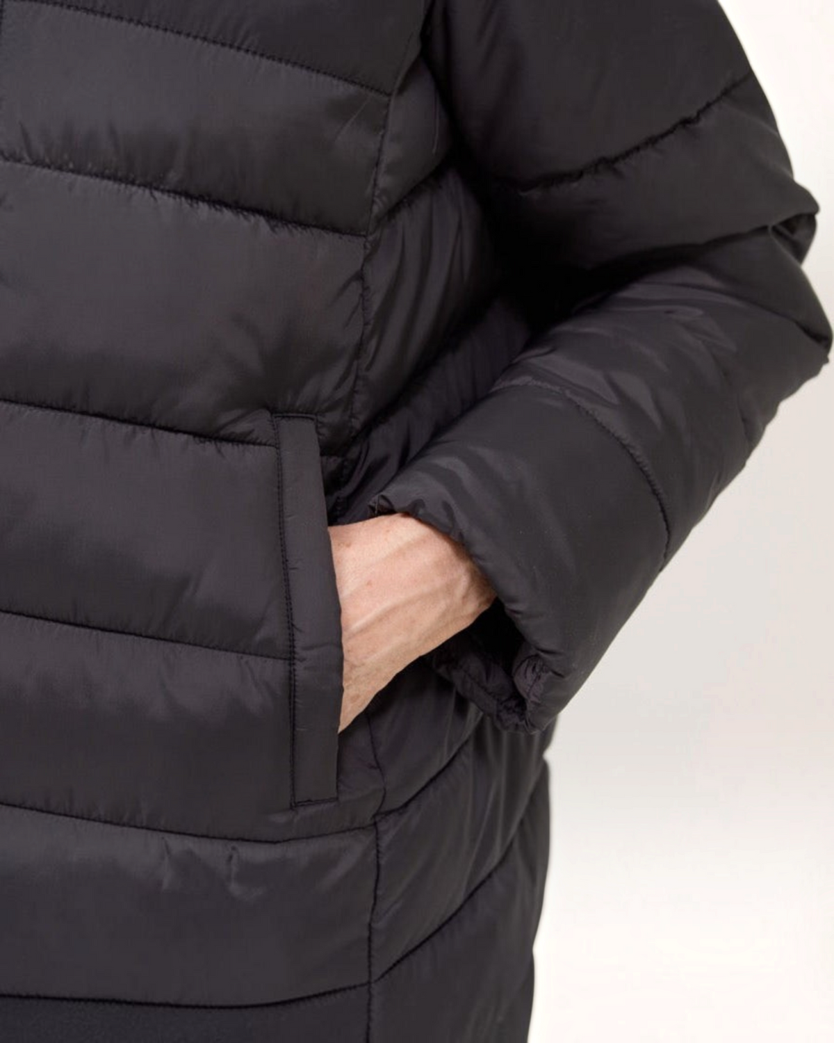 Weldun black magnetic puffer jacket featuring a welt pocket and water-resistant polyester fabric.