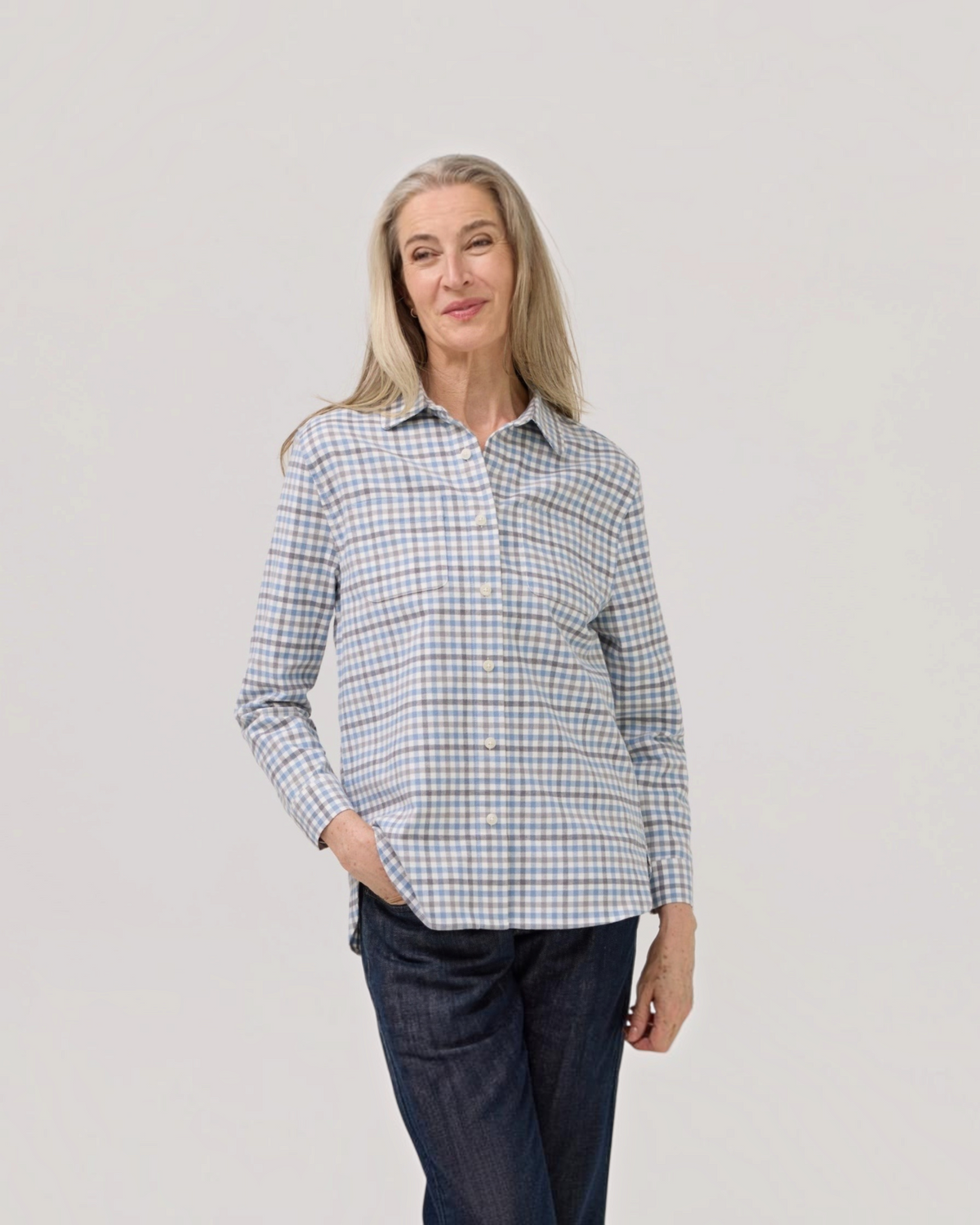 Weldun adaptive blue grey check flannel shirt with magnetic closures worn by a woman with long grey hair