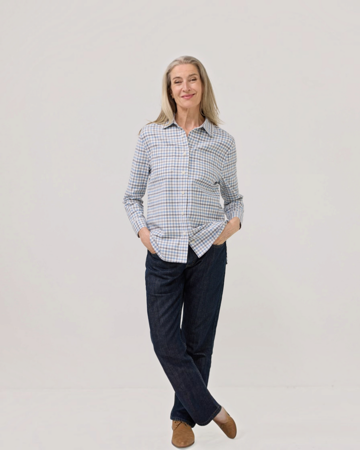 Weldun adaptive blue grey check flannel shirt with magnetic closures worn by a woman with long grey hair