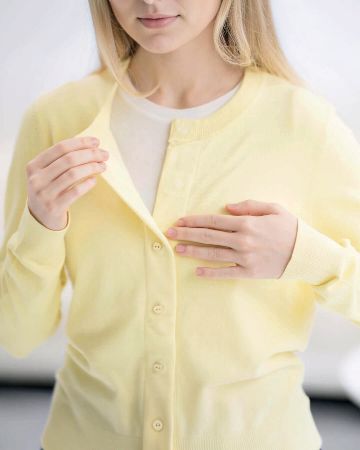 Weldun yellow adaptive knit cardigan with hidden magnetic front closures for easy dressing on a woman