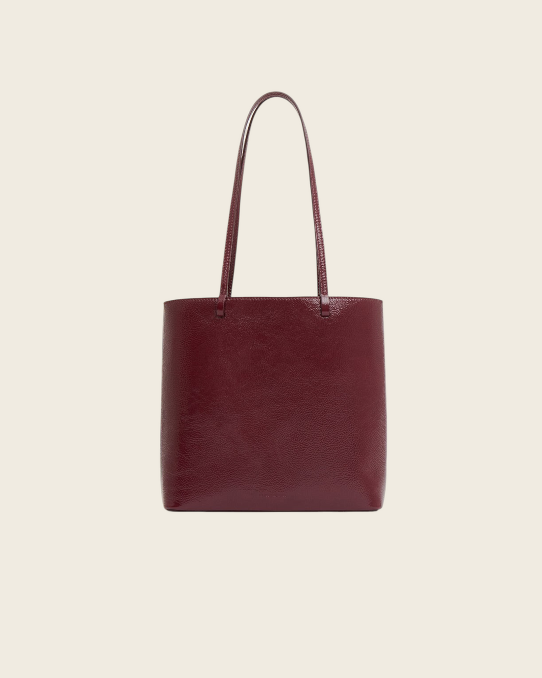 Weldun Filo Tote in claret red laminated Italian leather with a structured silhouette and long shoulder straps.