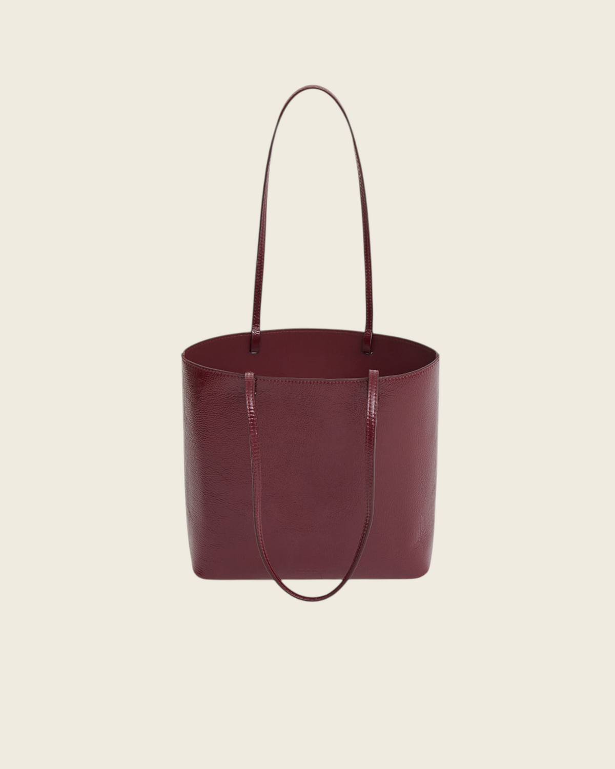 Weldun Filo Tote in claret red laminated Italian leather with a structured silhouette and long shoulder straps.