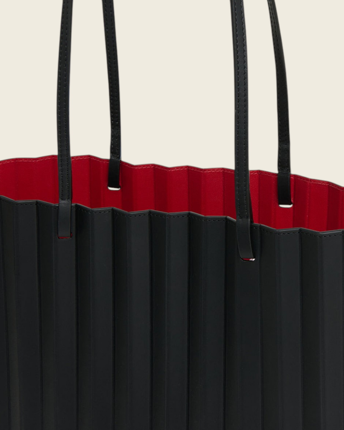 Weldun Mansur Gavriel black hand-pleated Italian leather tote bag with a vibrant red interior and shoulder straps.